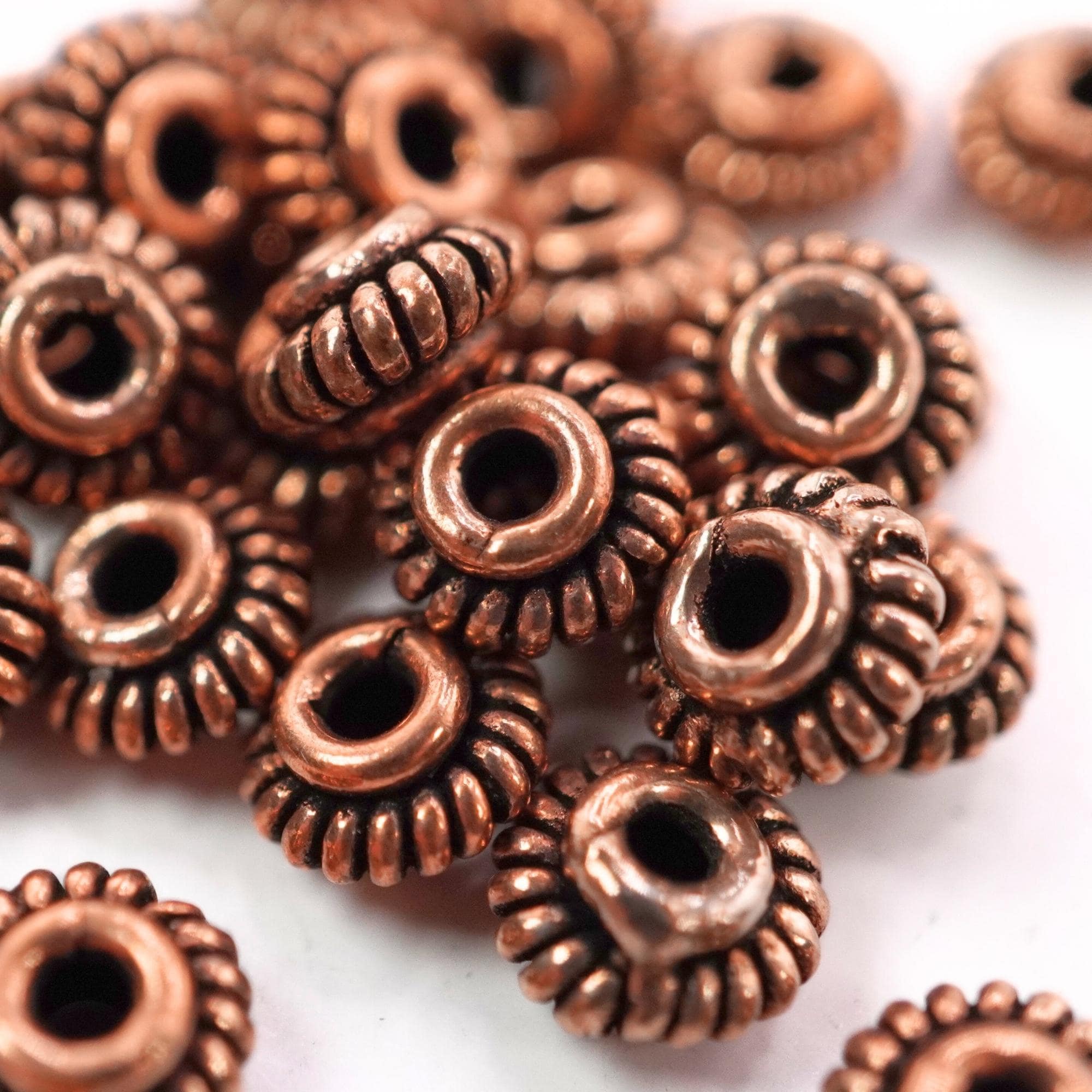Antique copper daisy spacer beads