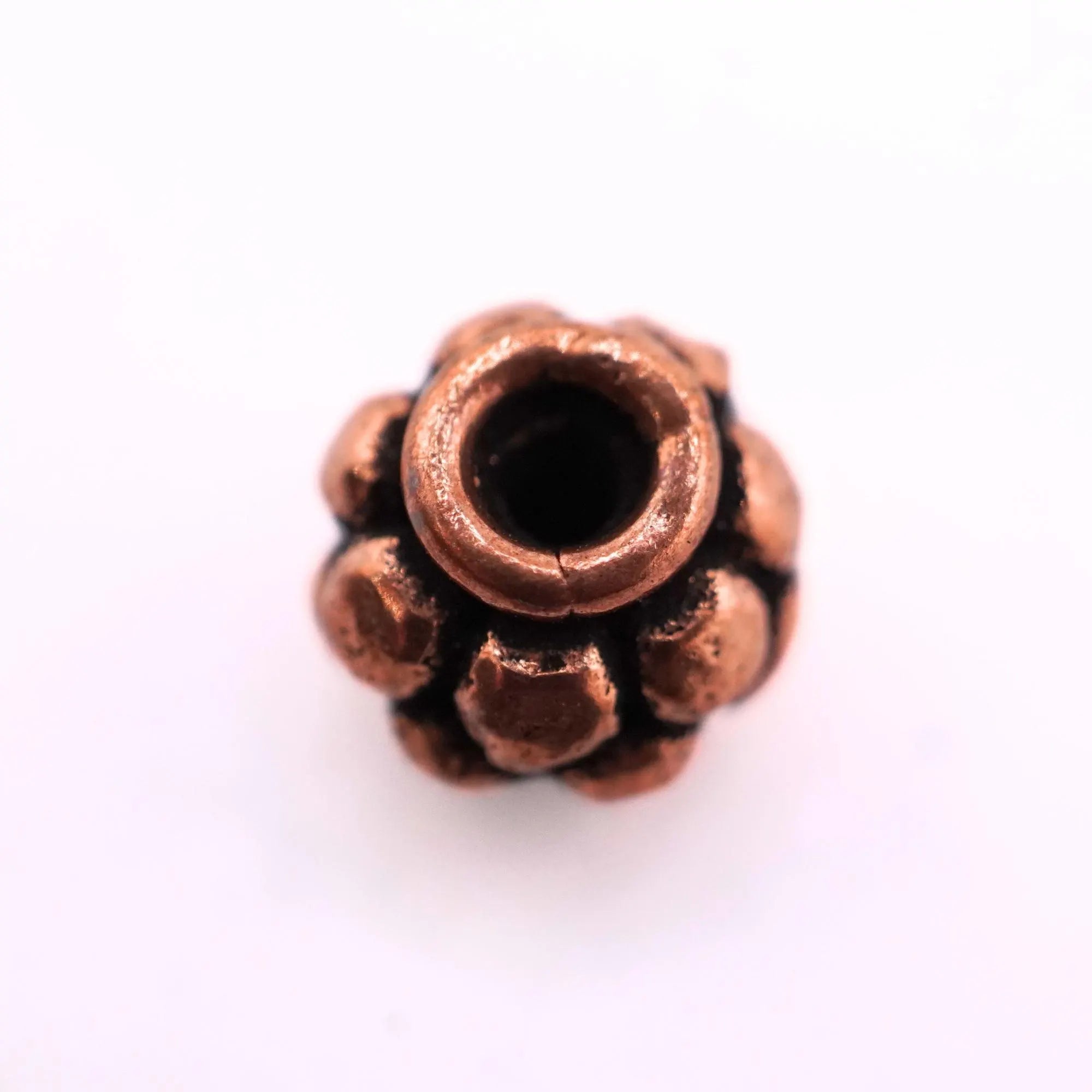 Antique copper daisy spacer beads