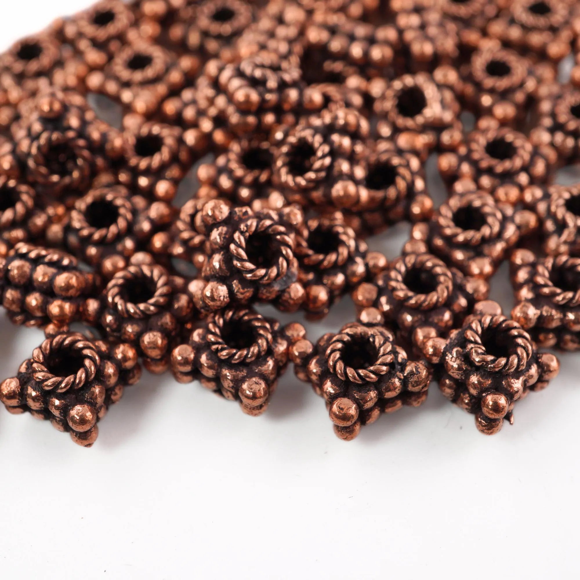 Antique copper daisy beads
