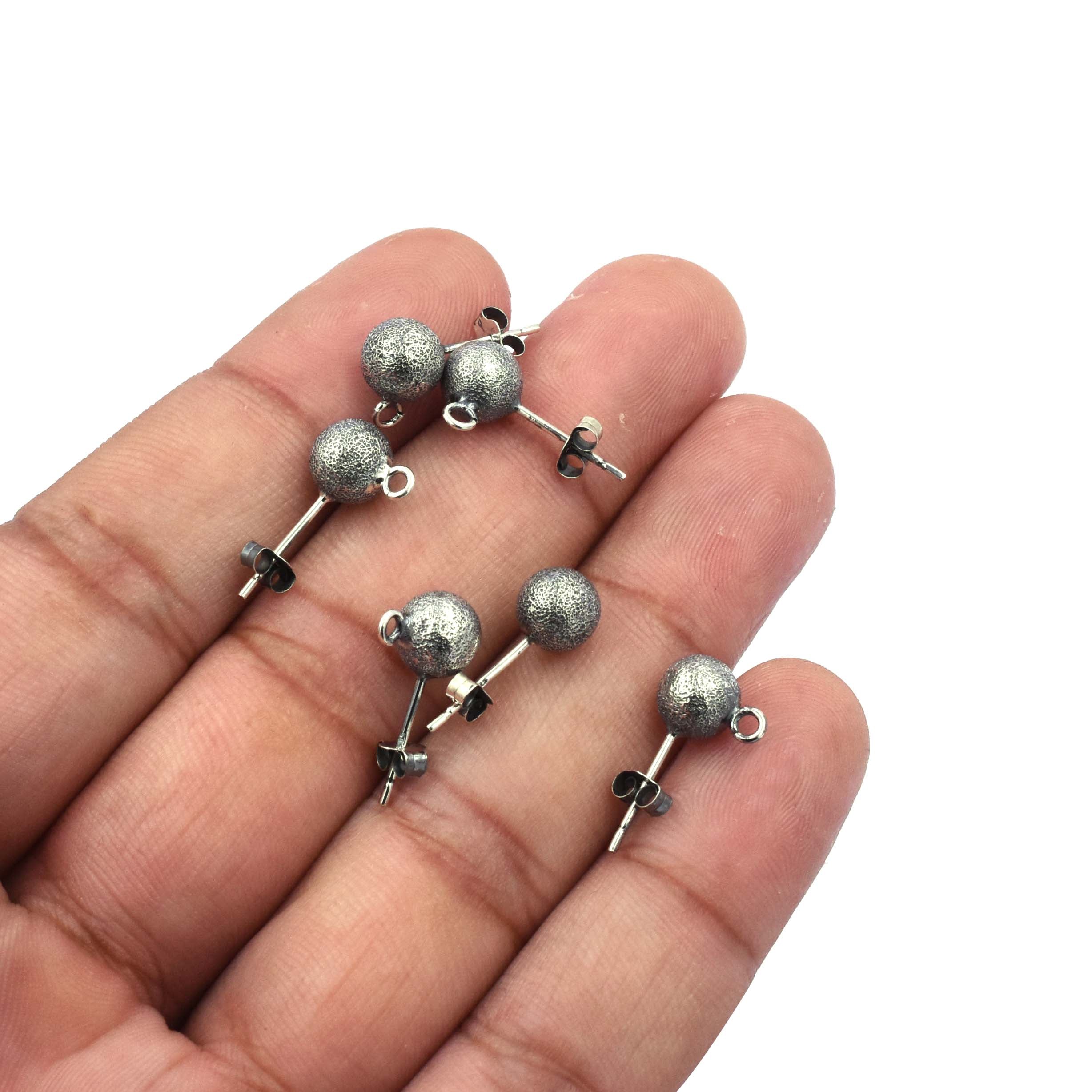 Close-up of Stardust Ball Stud Earrings in Sterling Silver