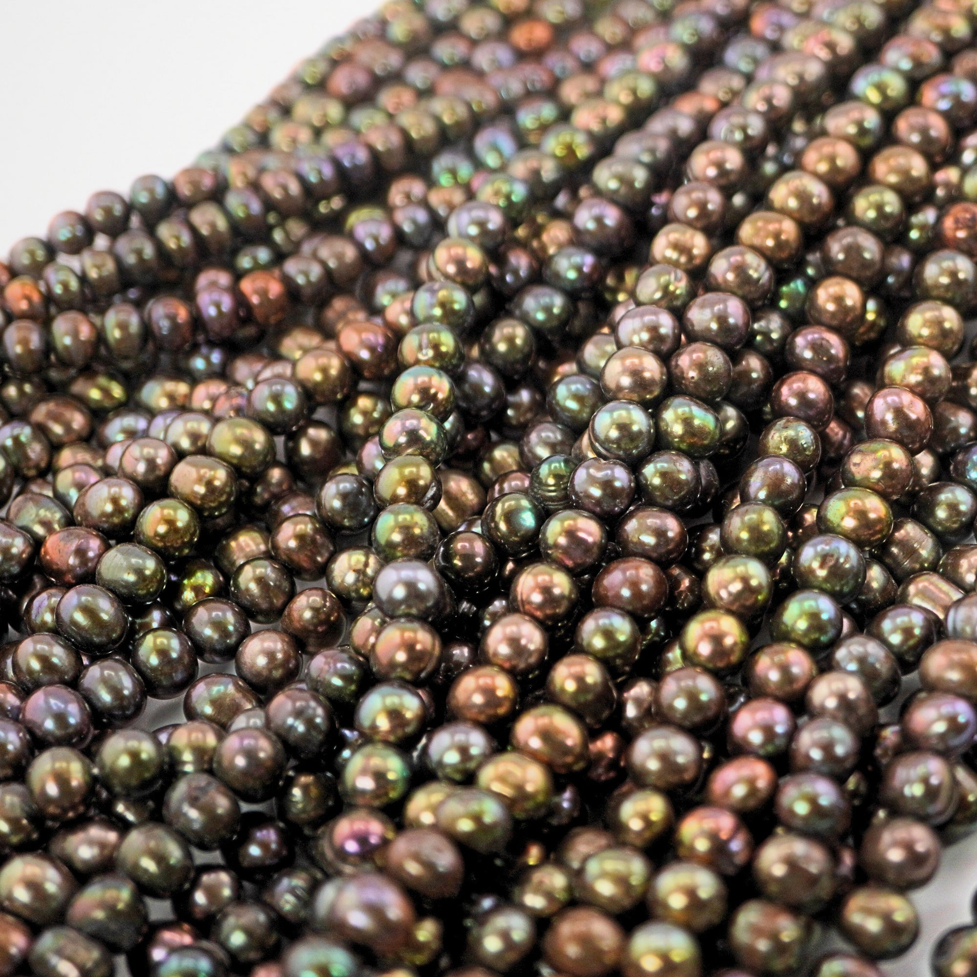 Colorful oval pearls for crafts