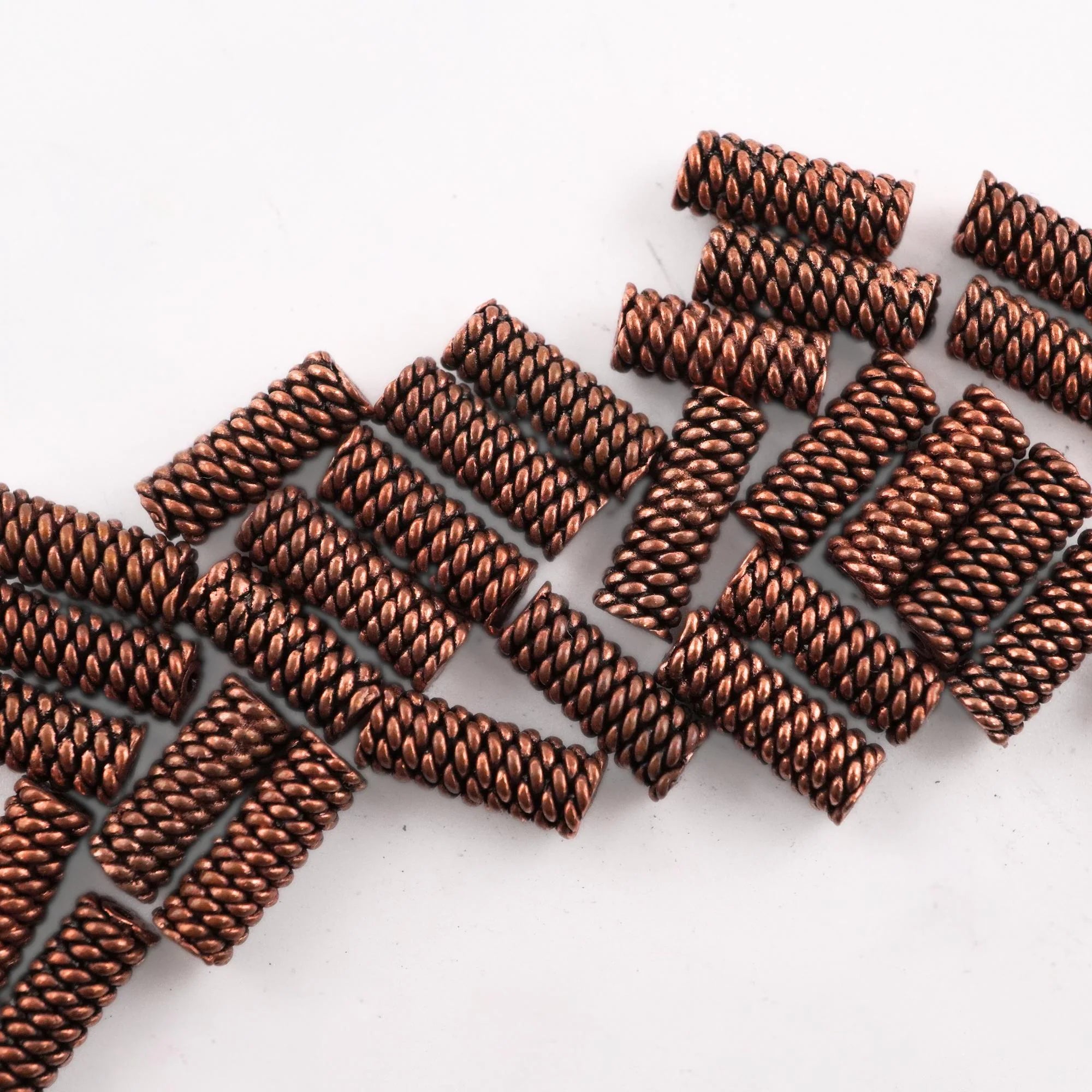 Copper tube shape spacer beads close-up