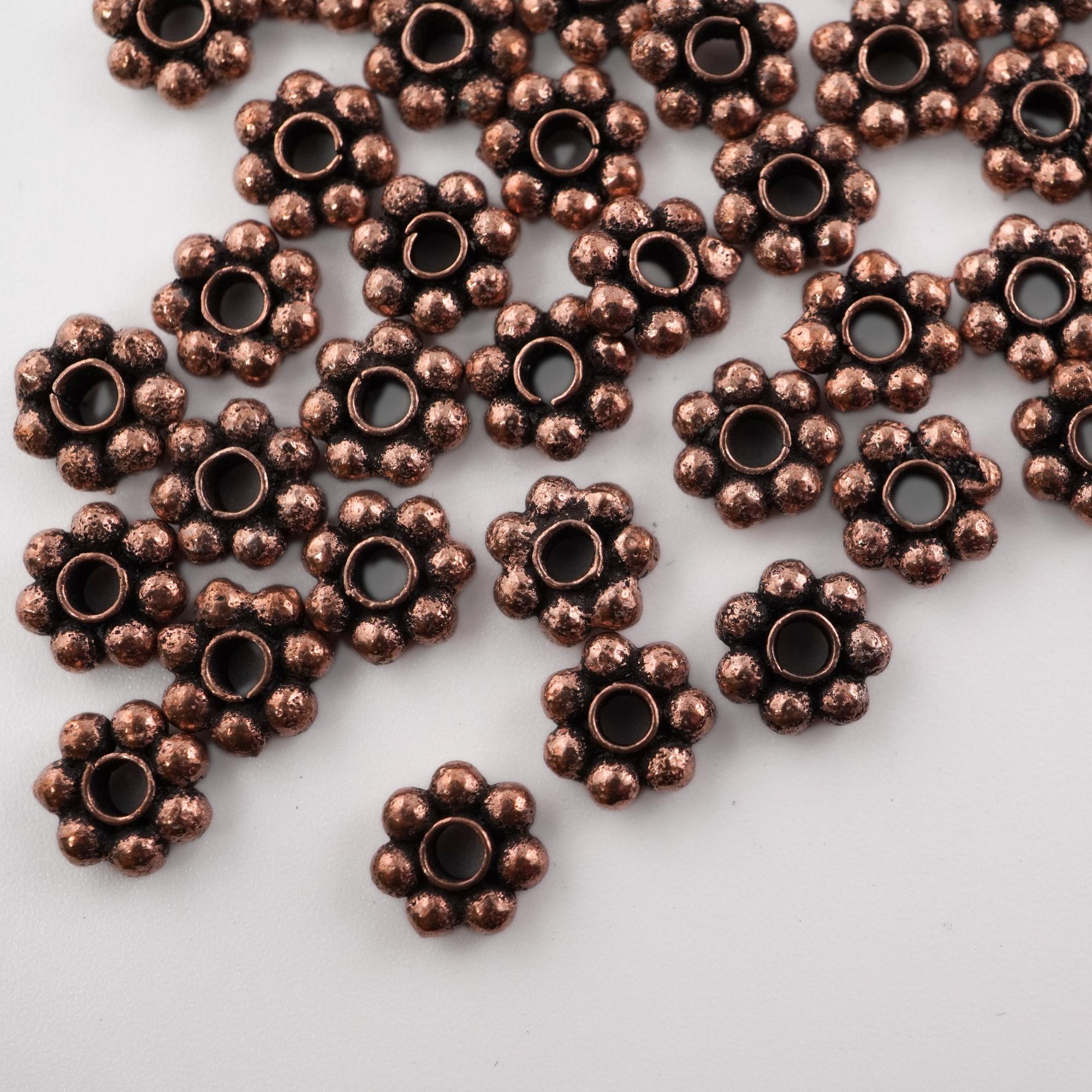 Flower-shaped antique copper beads