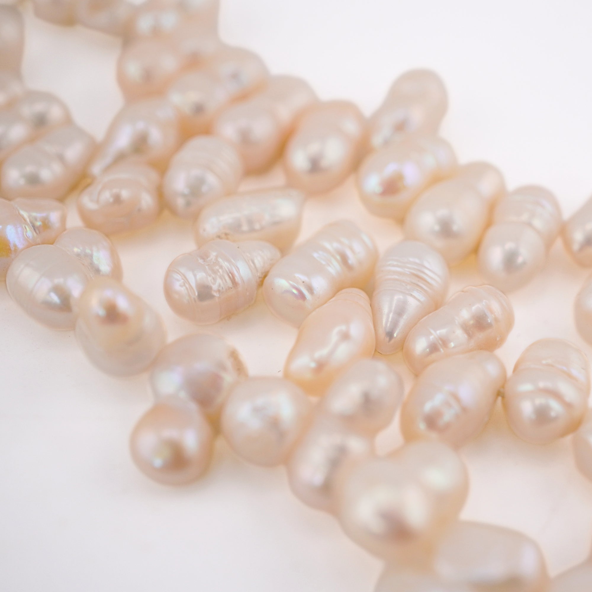 Freshwater white oval pearl strand