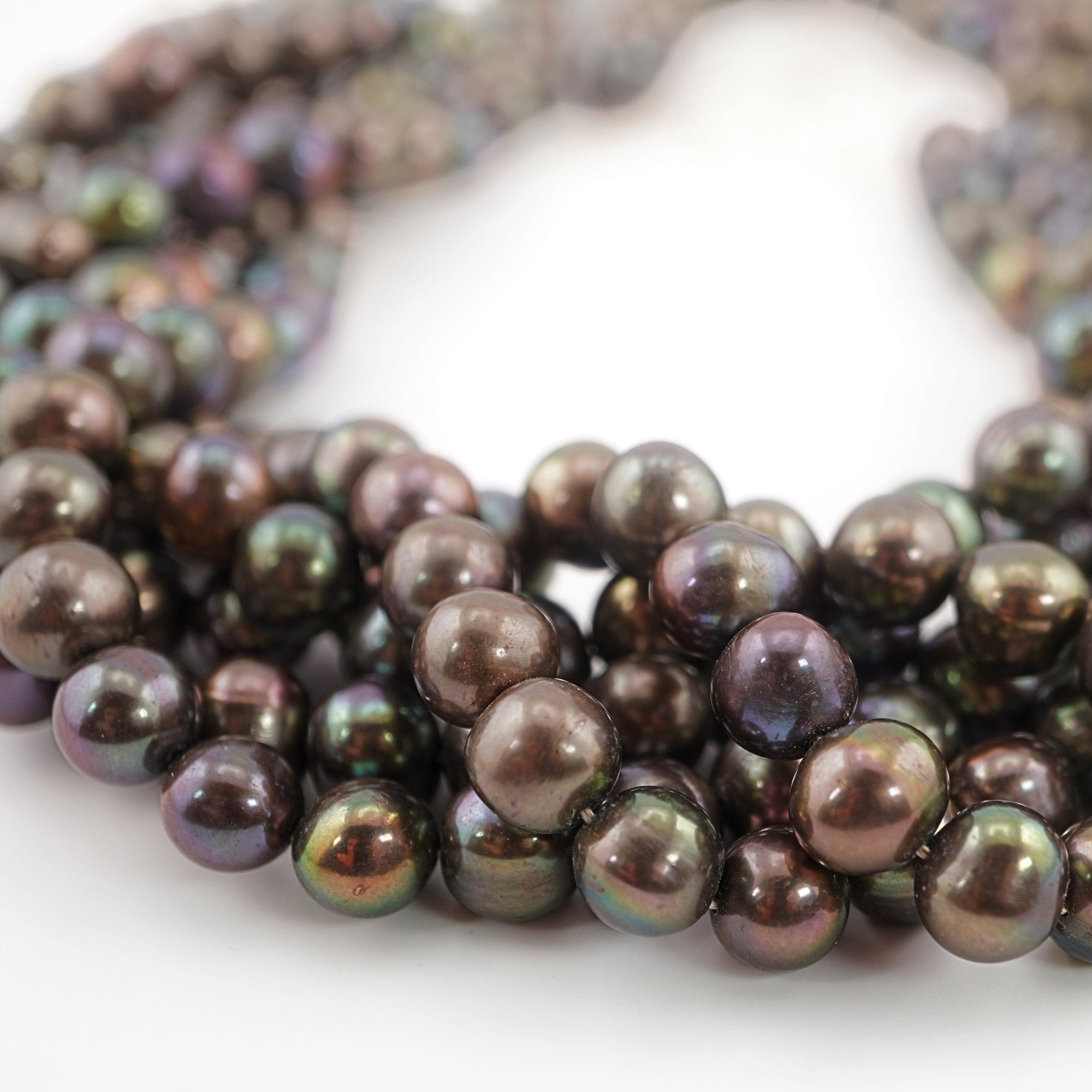 High-luster peacock oval pearls
