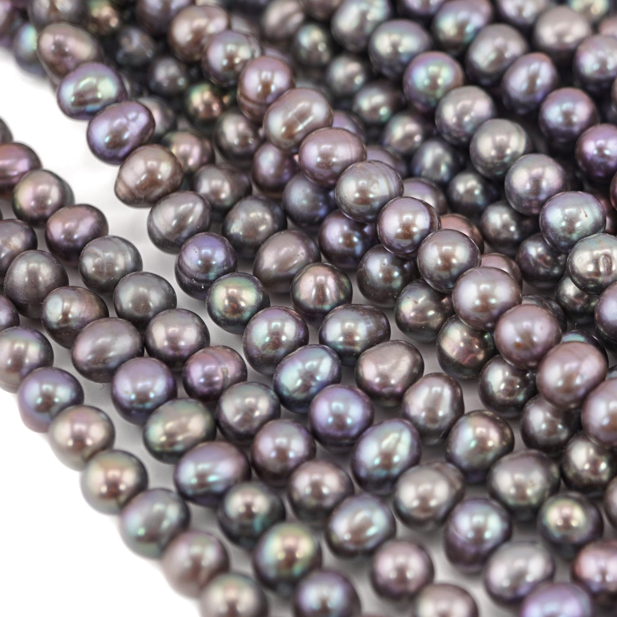 Iridescent peacock oval pearls