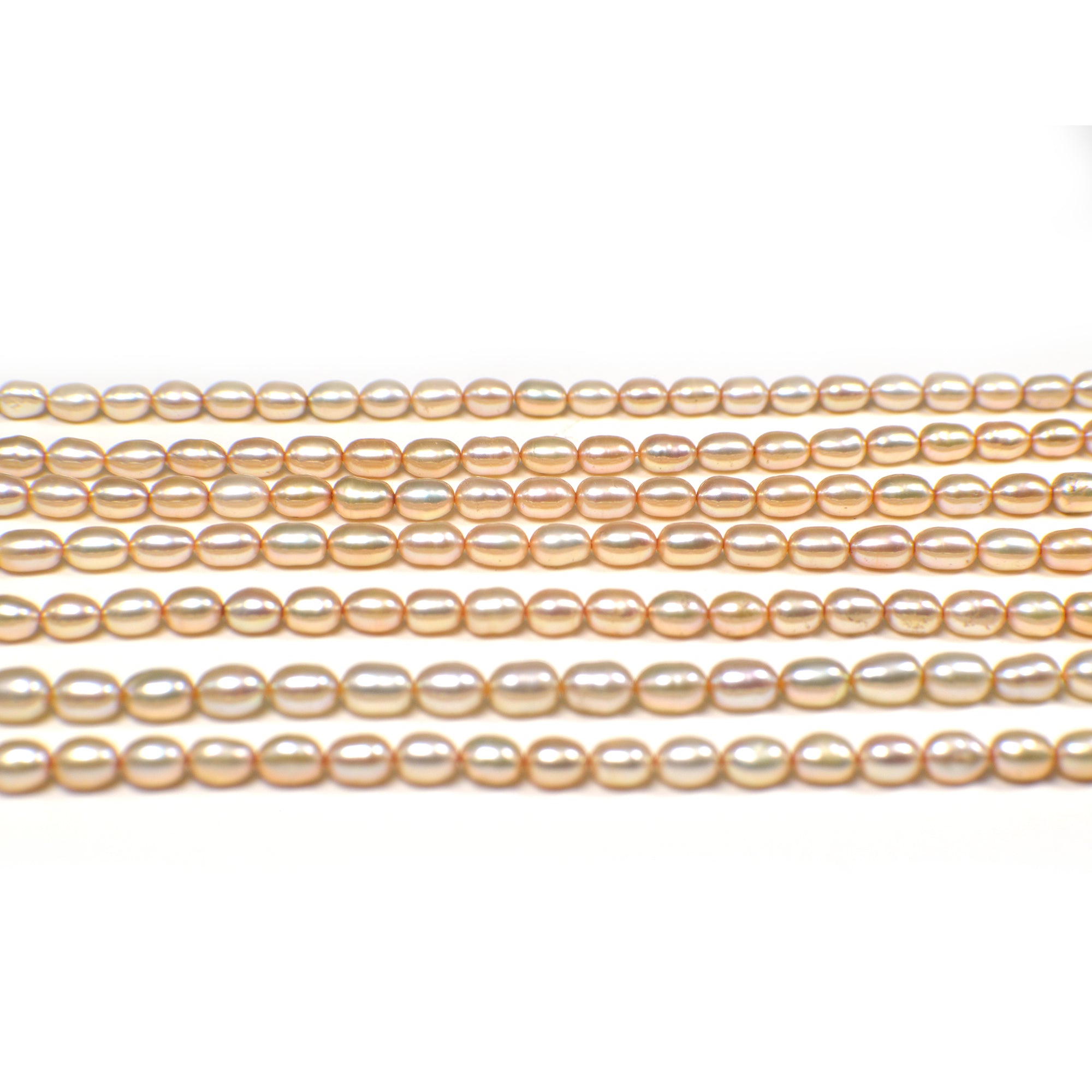6 x 4 - 7 x 4 MM Light Peach Rice Freshwater Pearls Beads