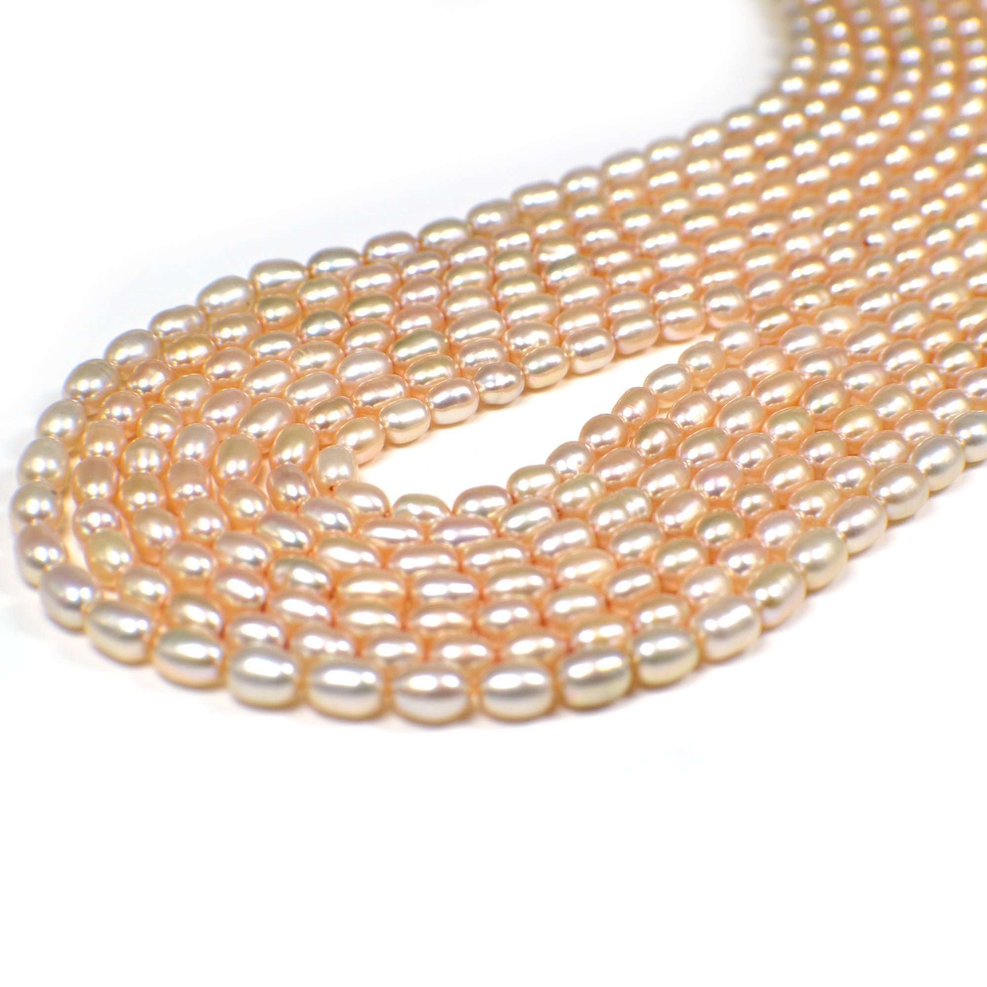 6 x 4 - 7 x 4 MM Light Peach Rice Freshwater Pearls Beads