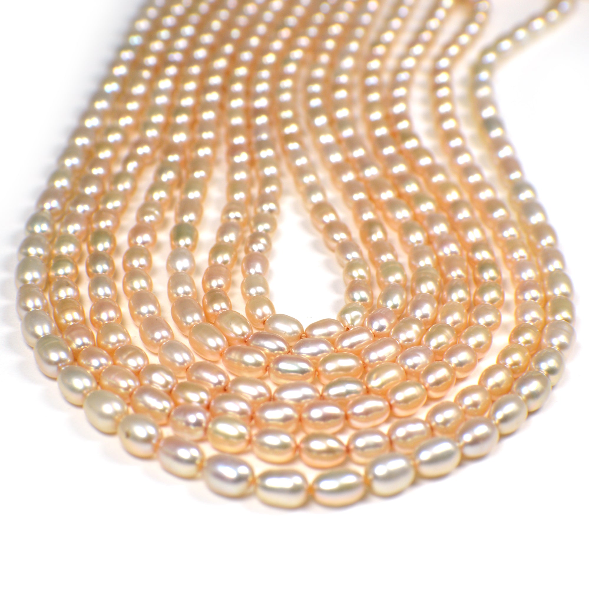6 x 4 - 7 x 4 MM Light Peach Rice Freshwater Pearls Beads