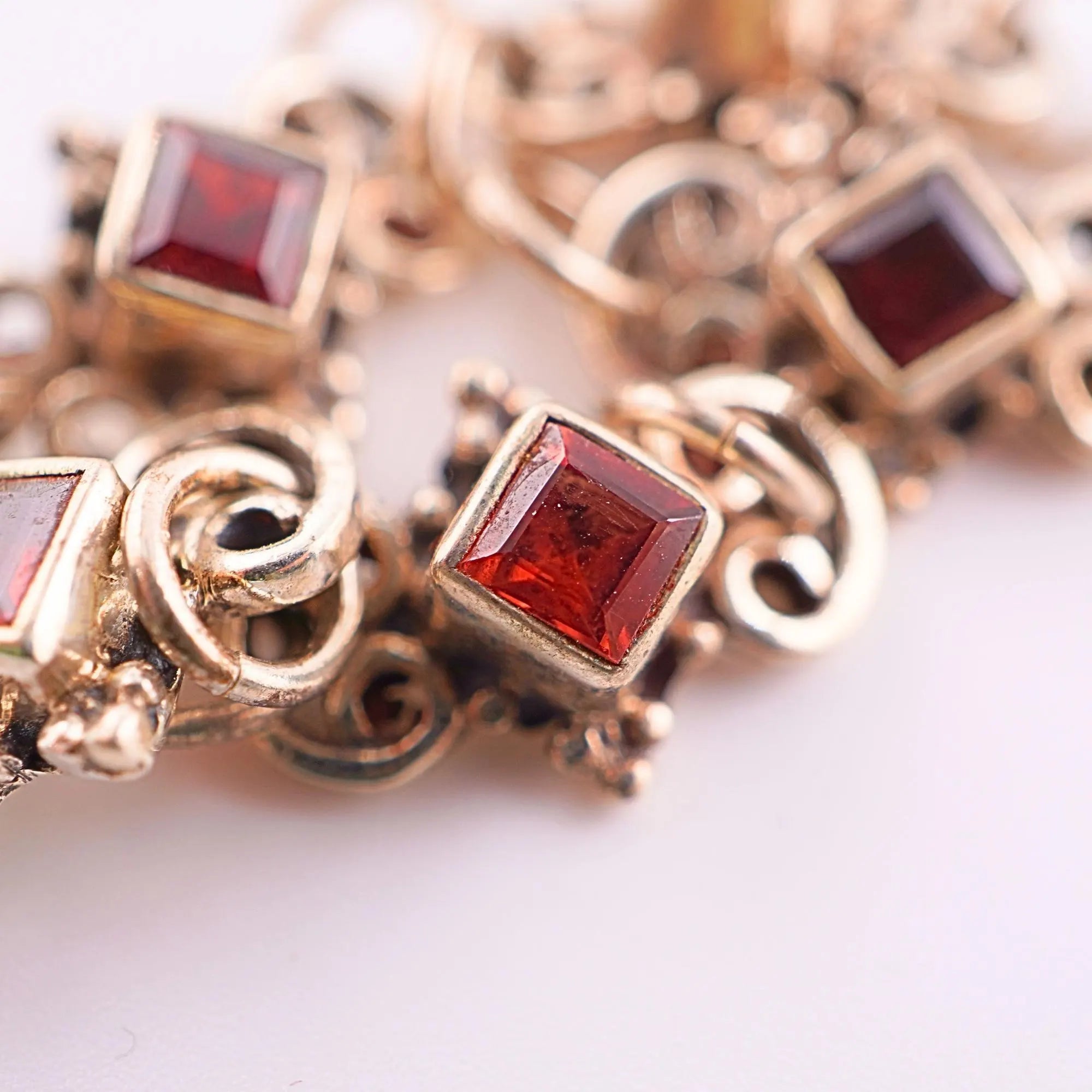 Jewelry charm with garnet gemstone