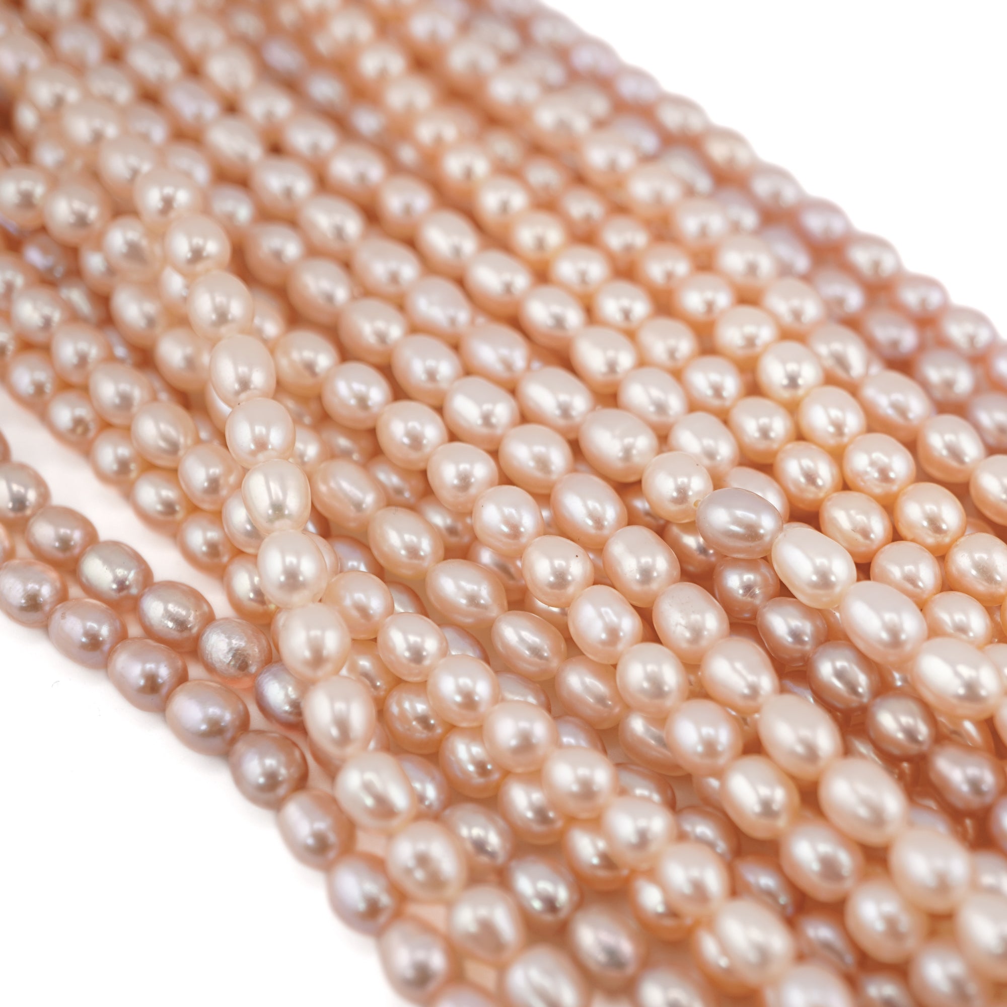 Oval freshwater pearl beads peach color