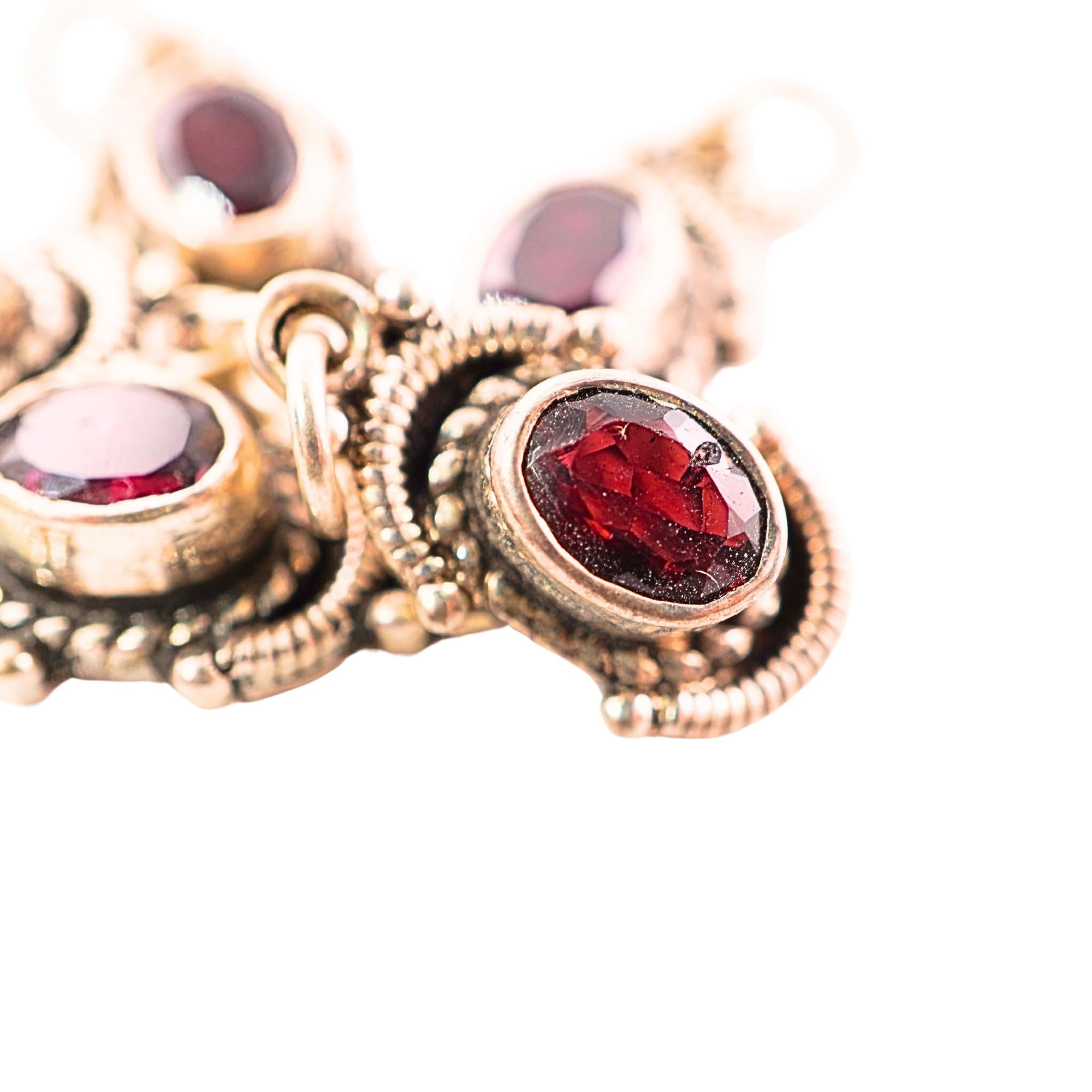 Oxidized silver charm with garnet gemstone