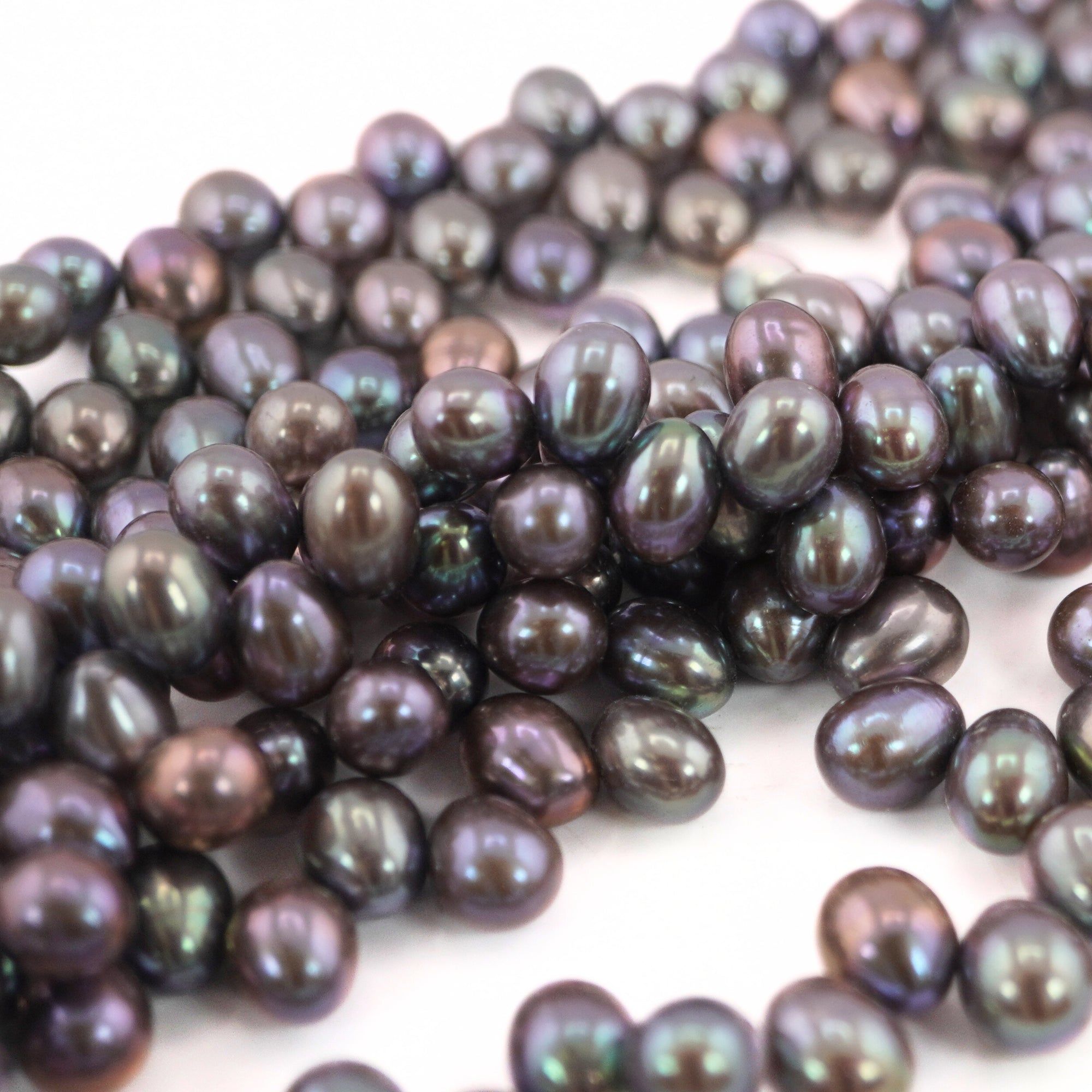 Premium Peacock Oval Freshwater Pearls