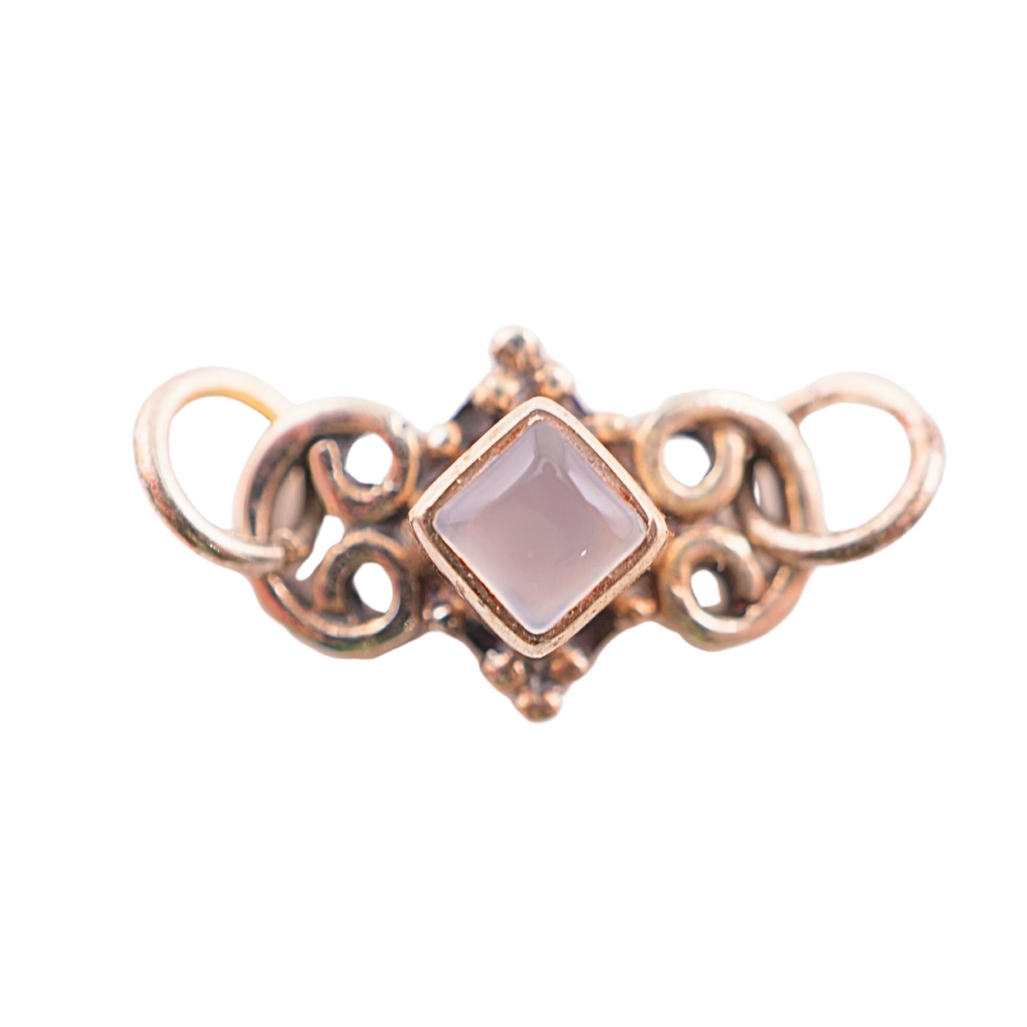 Rose quartz gemstone charm in silver