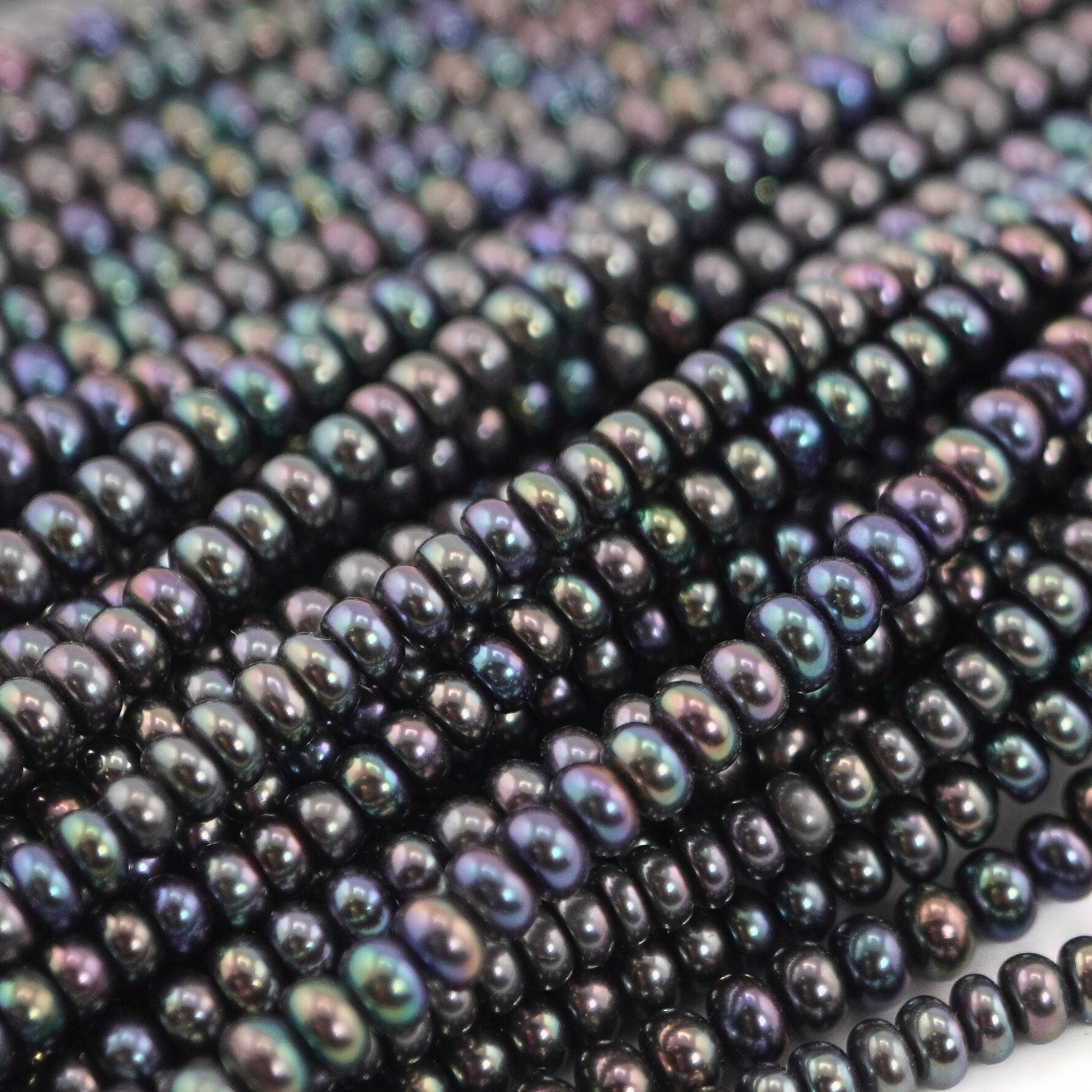close-up of 3MM peacock pearls
