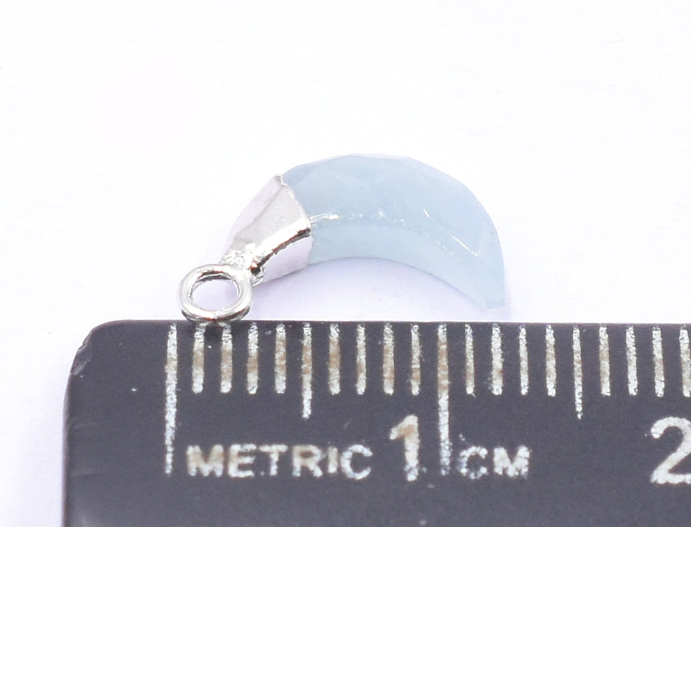 Vibrant aquamarine pendant shaped like an Moon