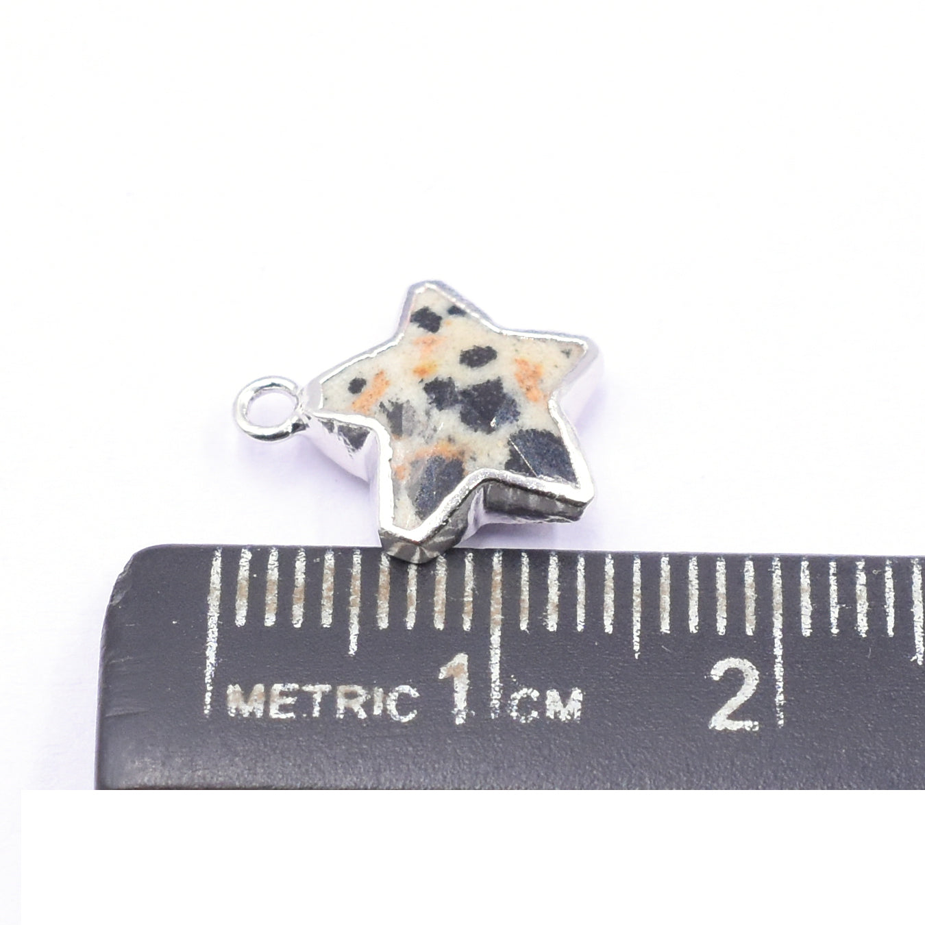 Stylish star shaped Dalmatian Jasper pendant with silver detail