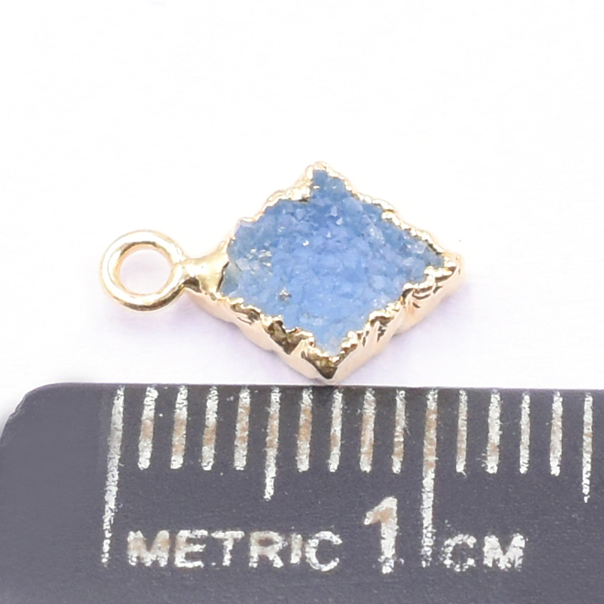 Elegant Blue Druzy diamond shaped pendant with gold detailing