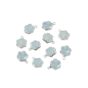 A set of two silver electroplated pendants in the shape of clover leaves with aquamarine gemstones.