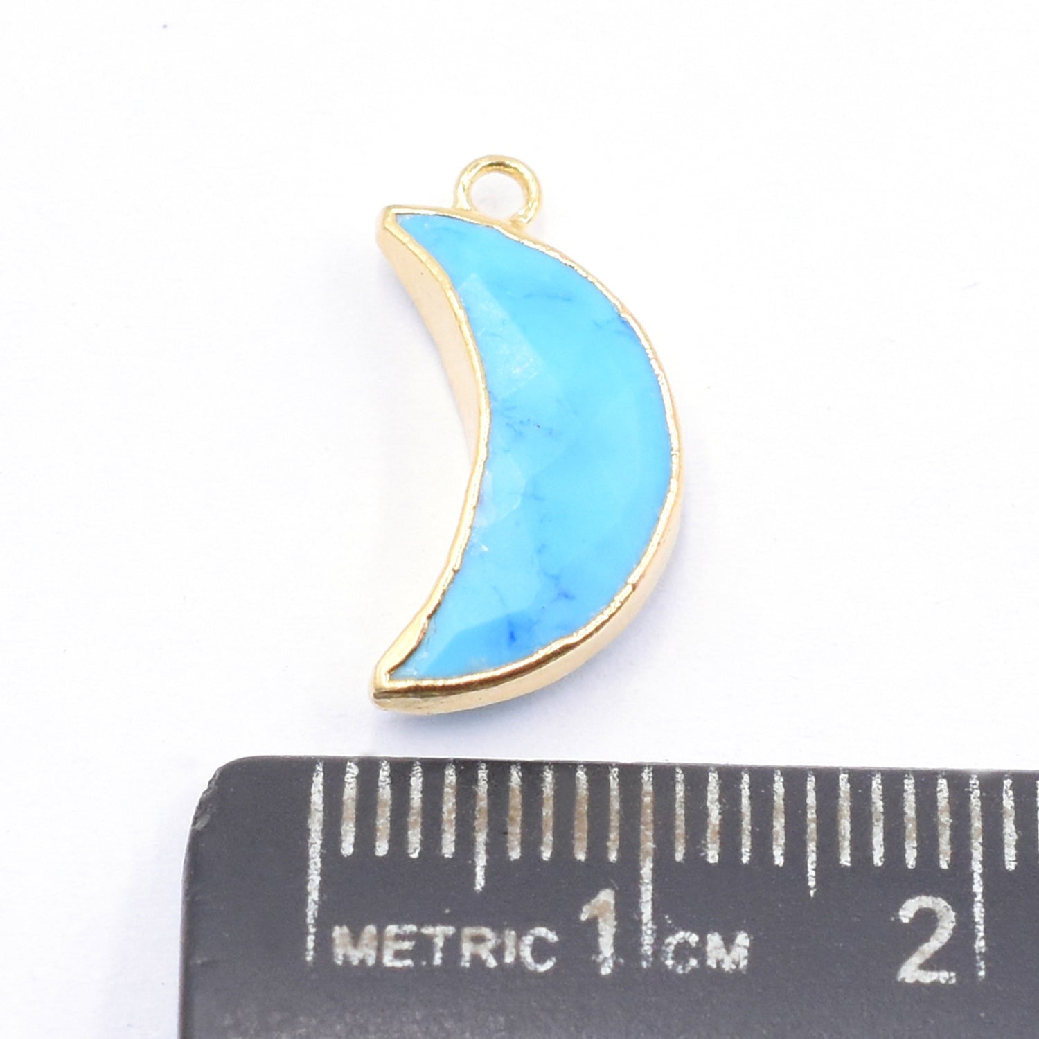 Howlite moon shaped pendant with gold finish