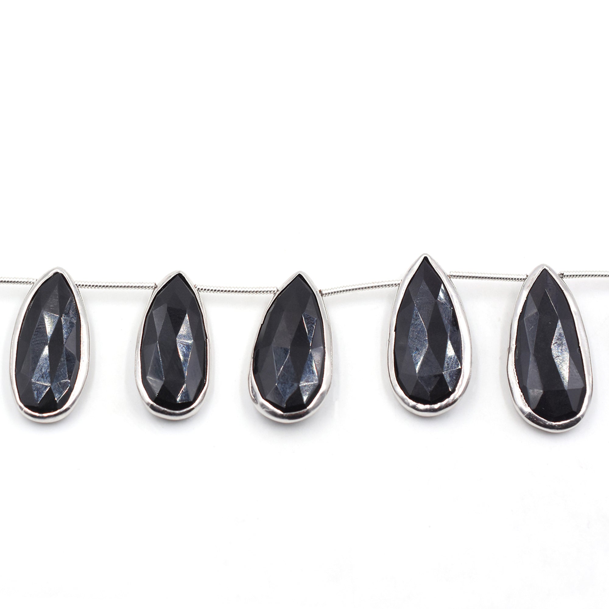 Pear black onyx in silver plated bezel