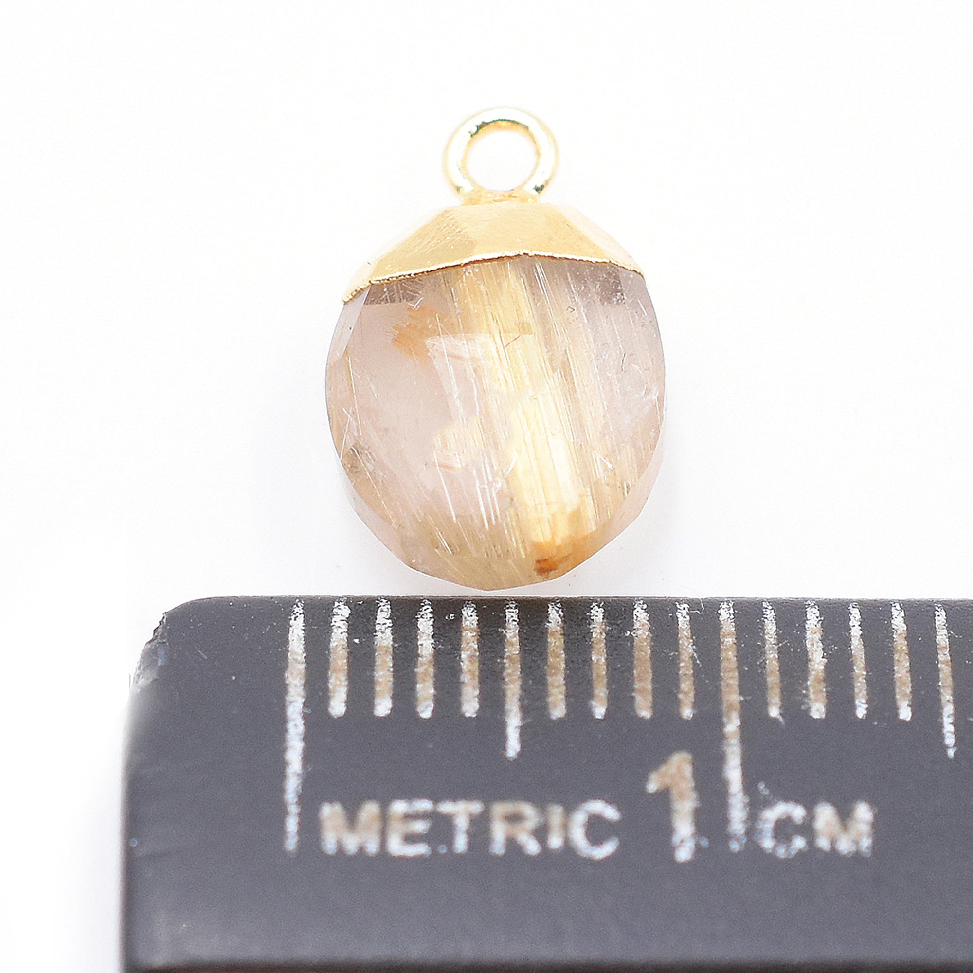 Close up of oval shape Golden Rutilated Quartz Pendant with Silver Finish