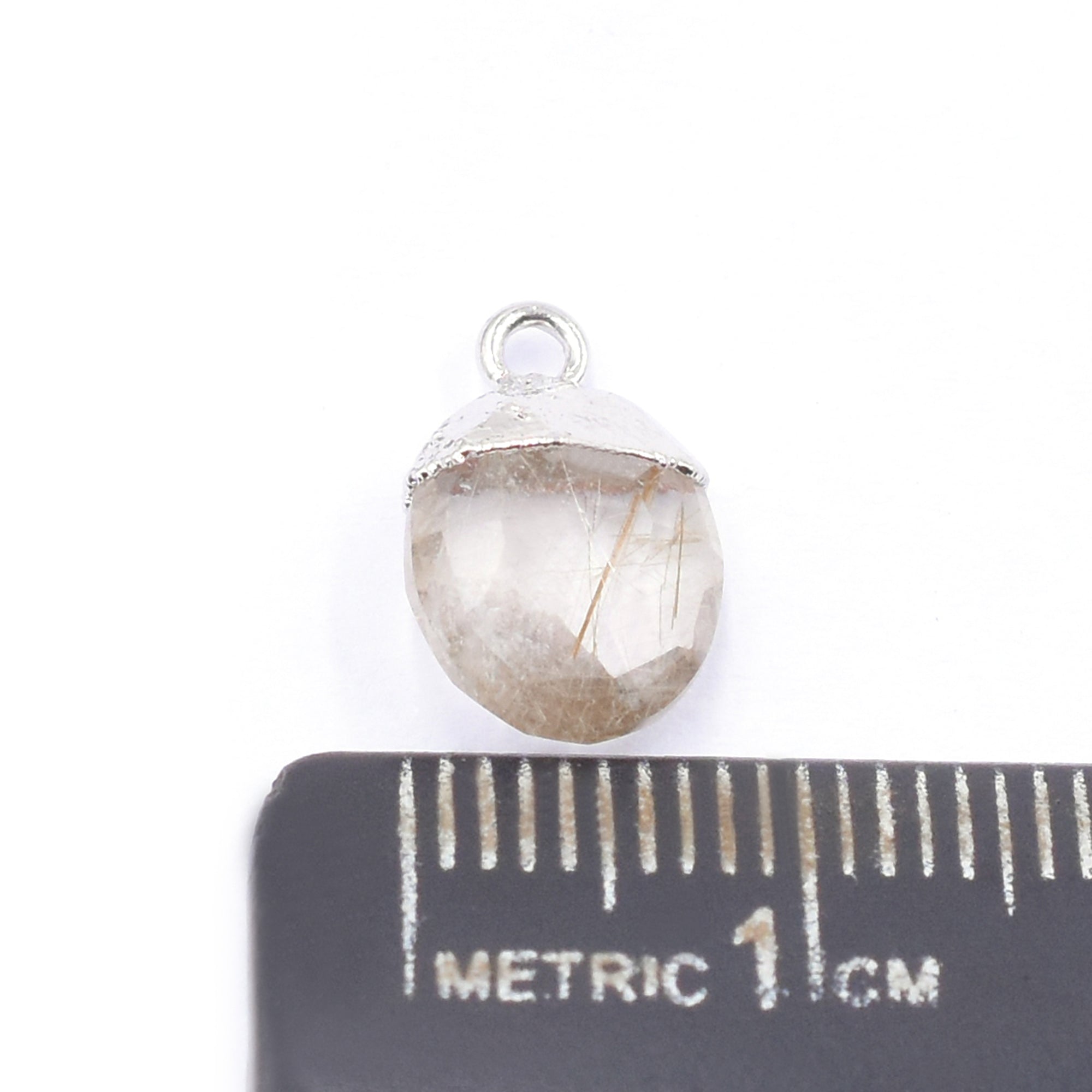 Close up of oval Shape Golden Rutilated Quartz Pendant with Silver Finish