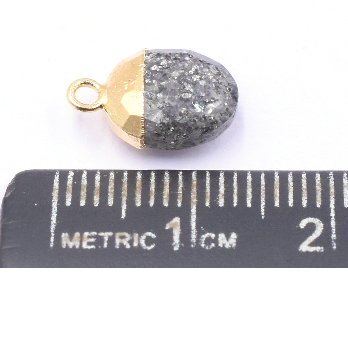 Sophisticated Black Sunstone oval pendant with gold detailing