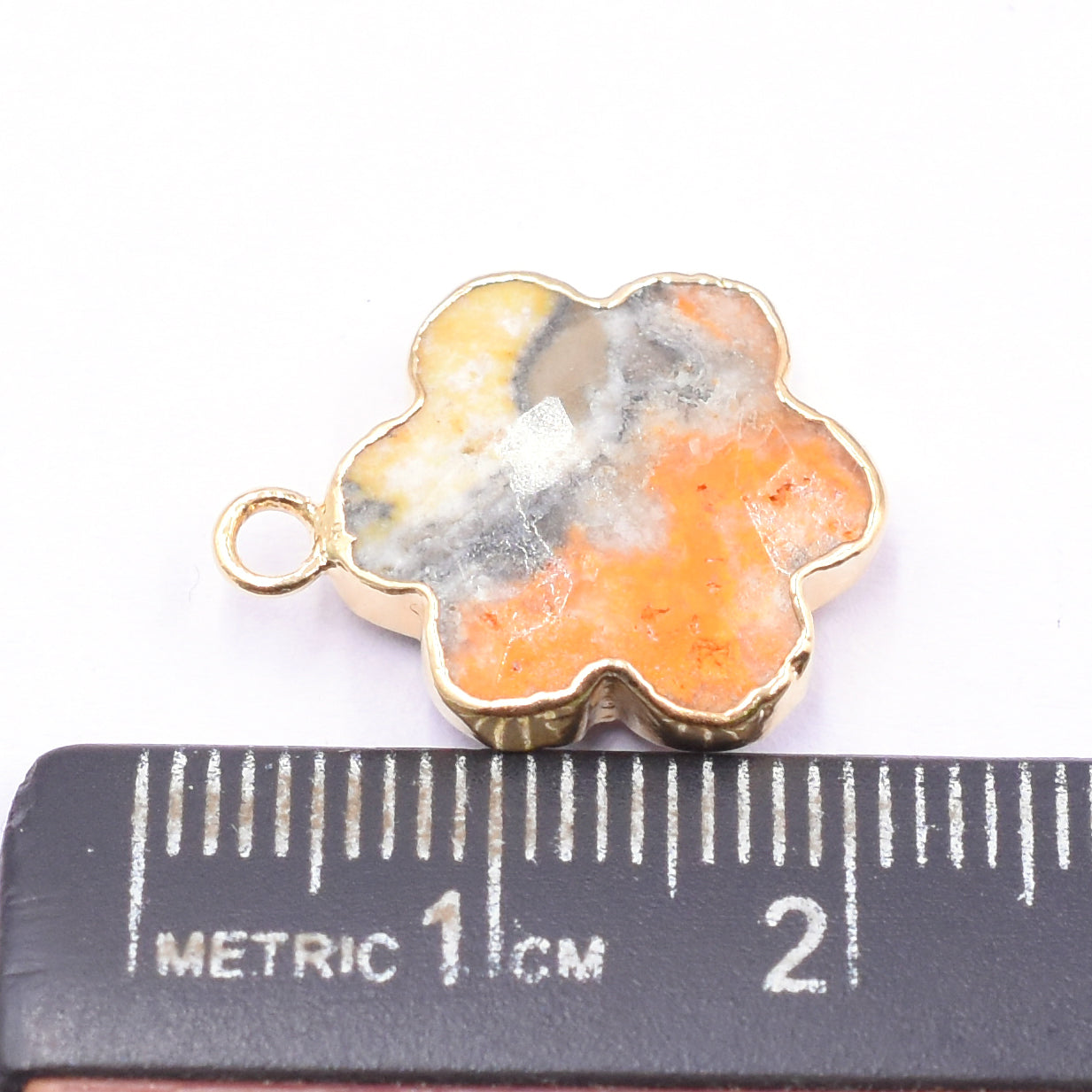 Vibrant Bumble Bee Jasper clover-shaped pendant with gold detailing