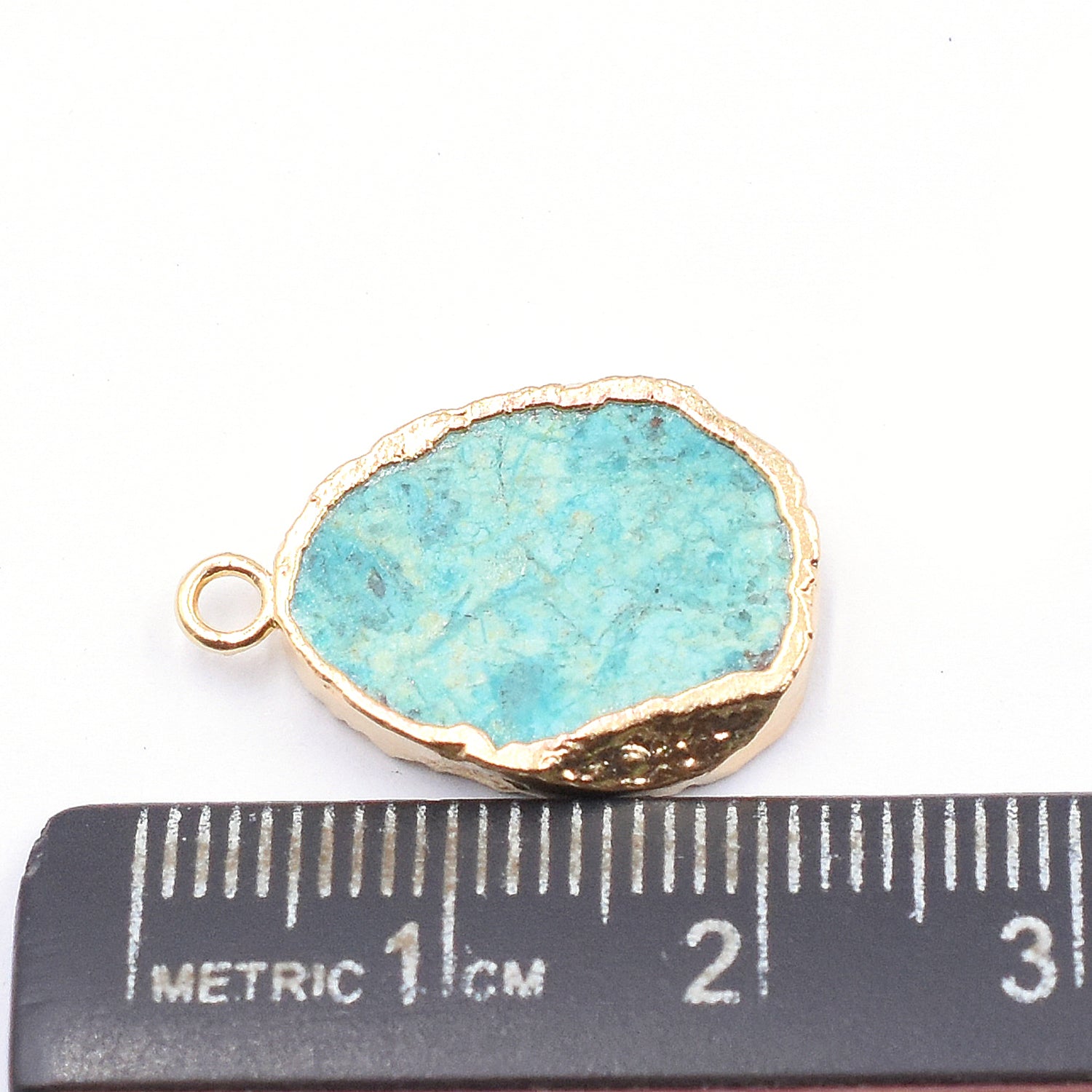 Stunning pear shaped Chrysocolla pendant with gold detailing