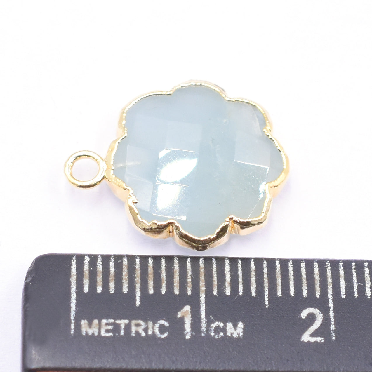 gold electroplated clover pendant with aquamarine gemstone