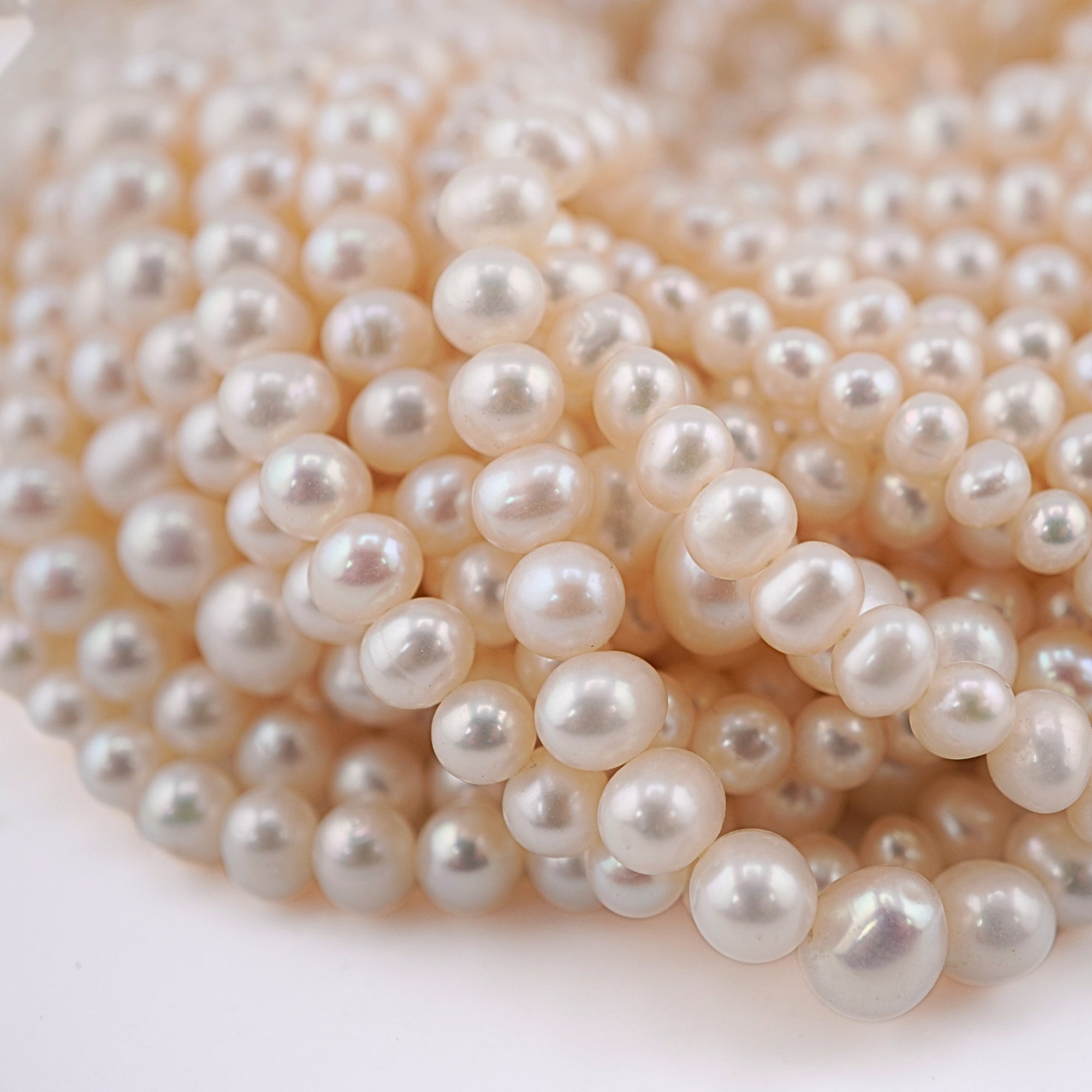 White Near Round Freshwater Pearls Beads