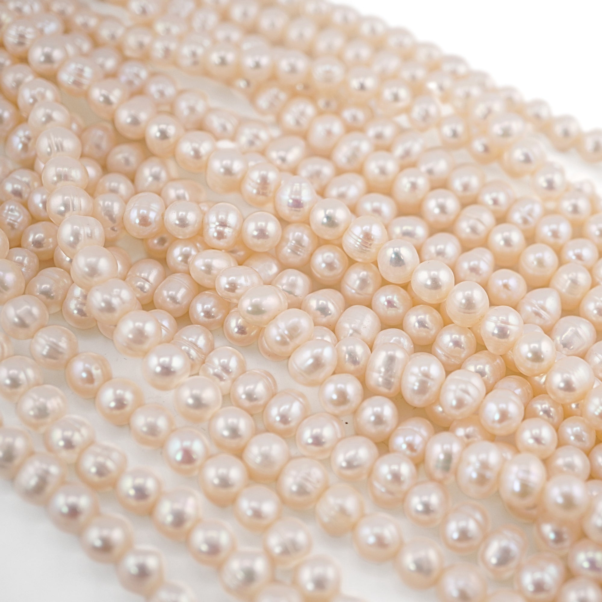 White Near Round Freshwater Pearls Beads