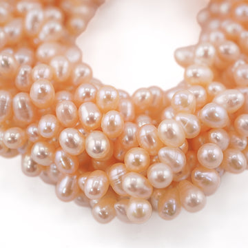 7 x 5 - 6 x 5 MM Peach Oval Freshwater Pearls Beads