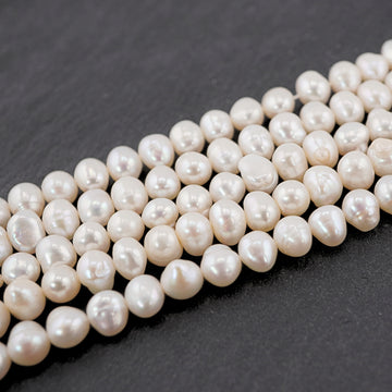 10 x 7 - 8 x 6 MM White Near Round Freshwater Pearls Beads