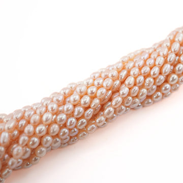 6 x 4 - 5 x 4 MM Peach Rice / Oval Freshwater Pearls Beads