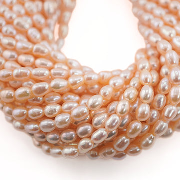 7 x 4 - 6 x 4 MM Peach Rice / Oval Freshwater Pearls Beads