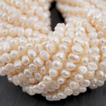 8 x 4 - 7 x 4 MM White Baroque Freshwater Pearls Beads