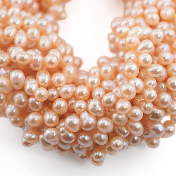 7 x 4 - 7 x 5 MM Peach Oval Freshwater Pearls Beads