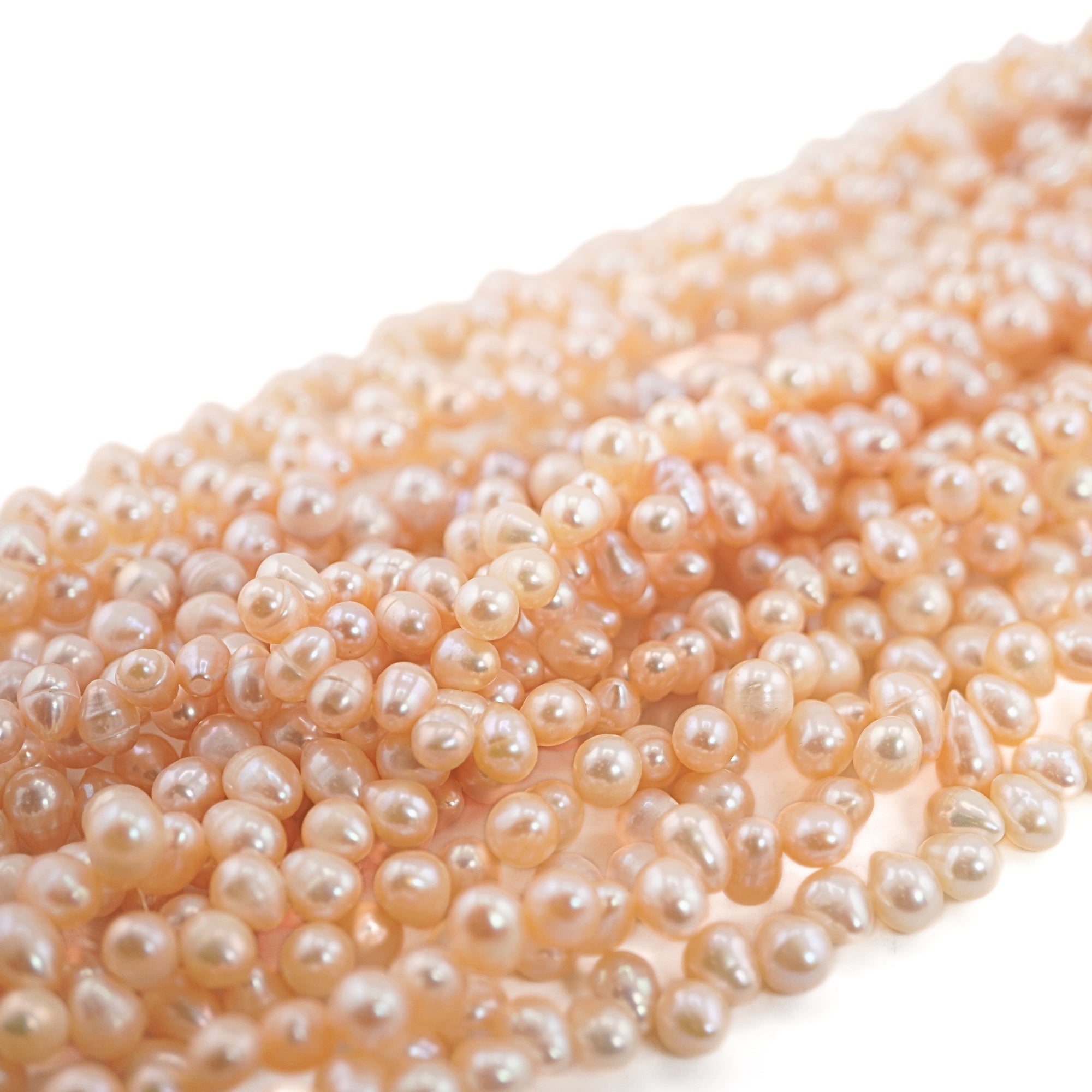 9 x 6 - 8 x 7 MM Peach Oval Freshwater Pearls Beads