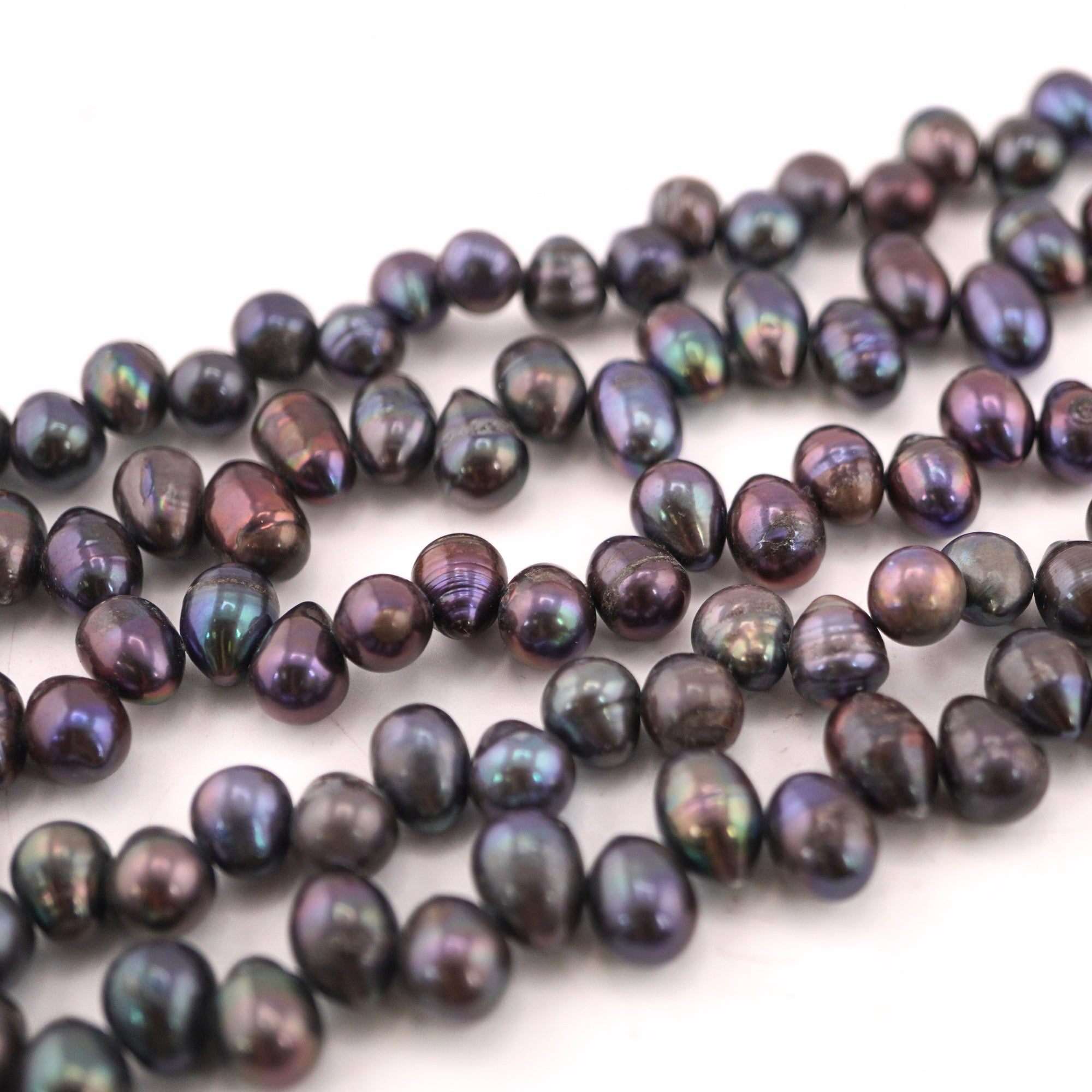 11 x 7 - 9 x 7 MM Peacock Oval Freshwater Pearls Beads