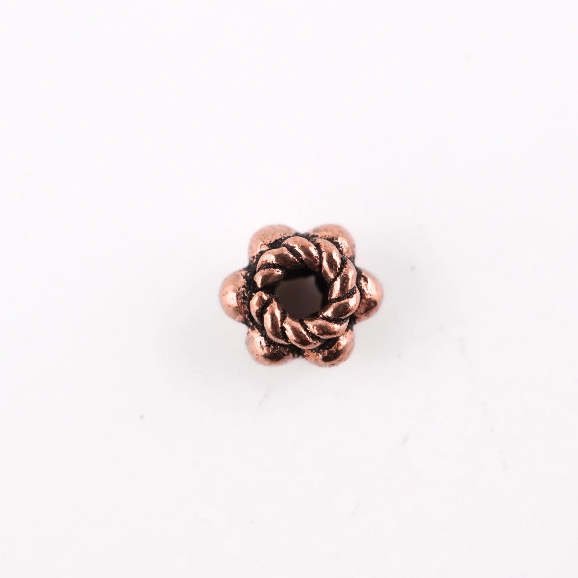 Flower-shaped copper spacer beads

