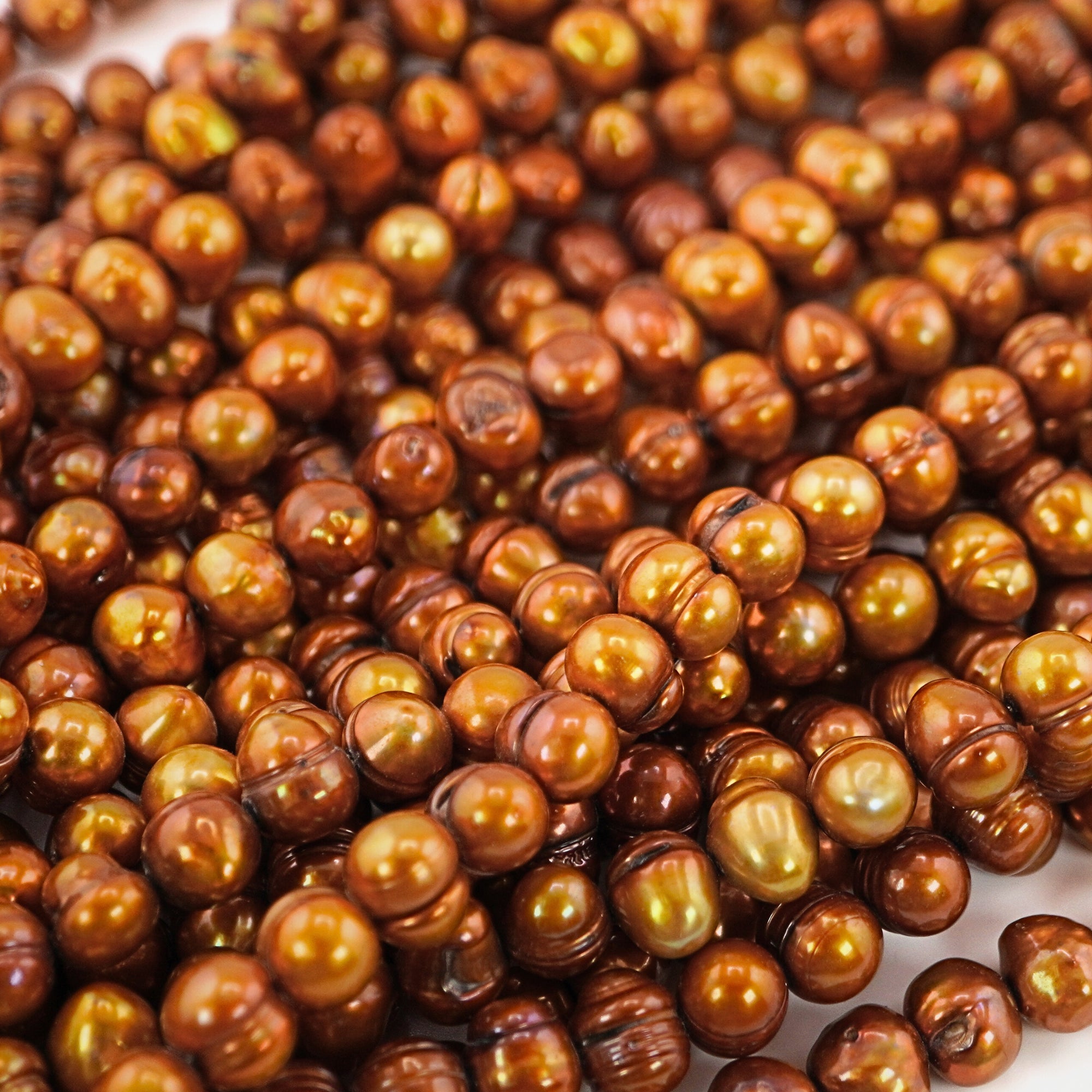 High-quality golden oval pearls


