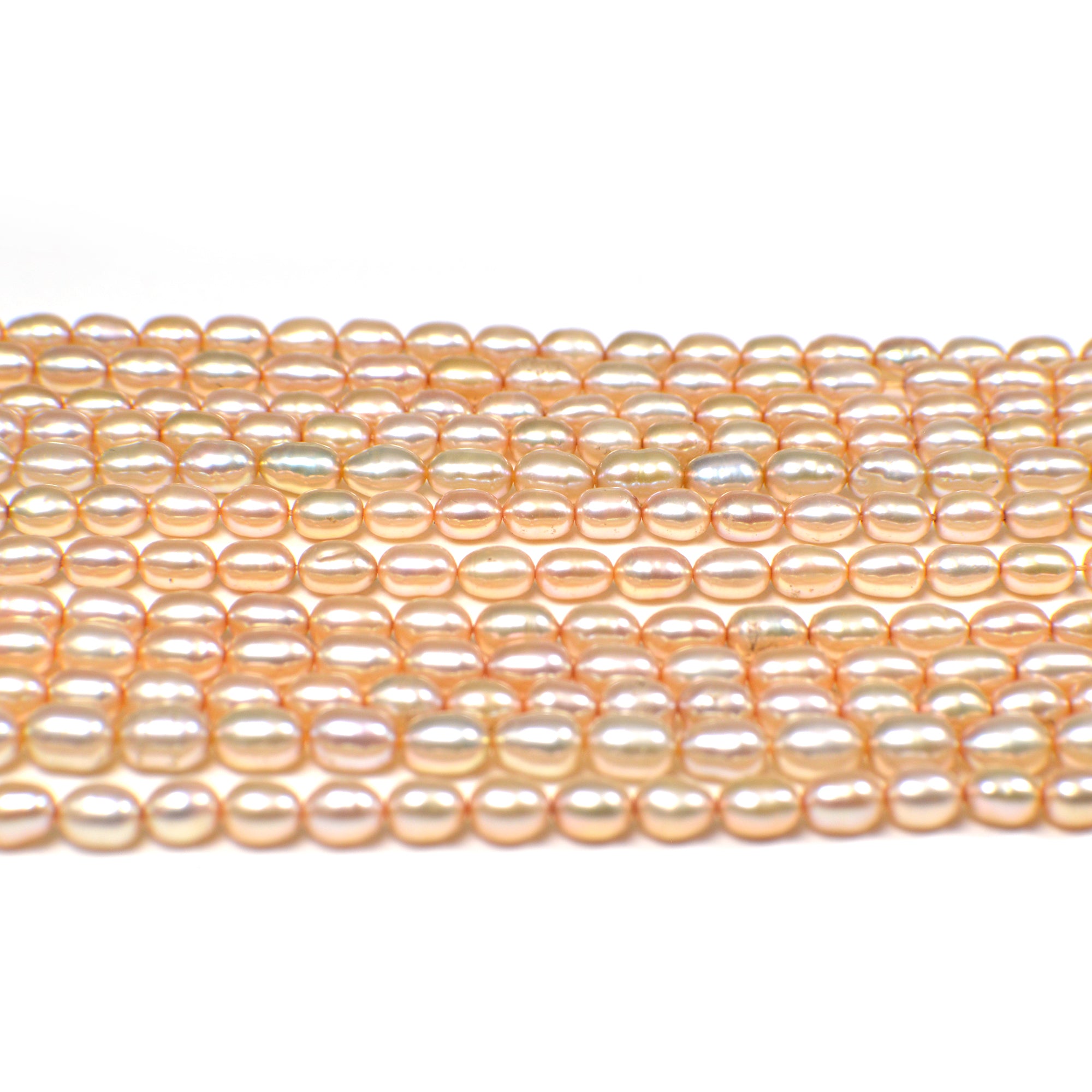 6 x 4 - 7 x 4 MM Light Peach Rice Freshwater Pearls Beads