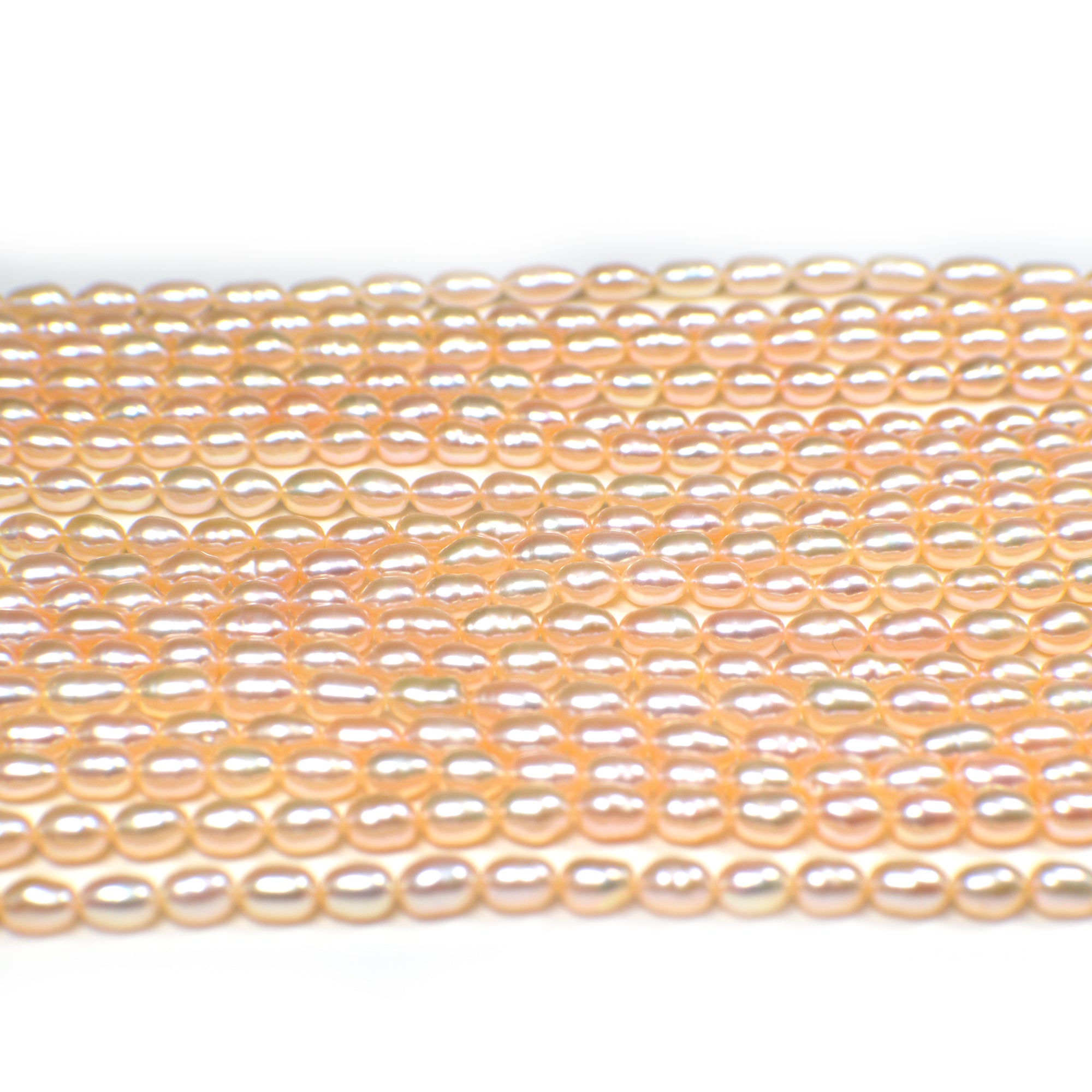 6.5x5.5 - 7.5x5.5 MM Light Peach Rice / Oval Freshwater Pearls Beads