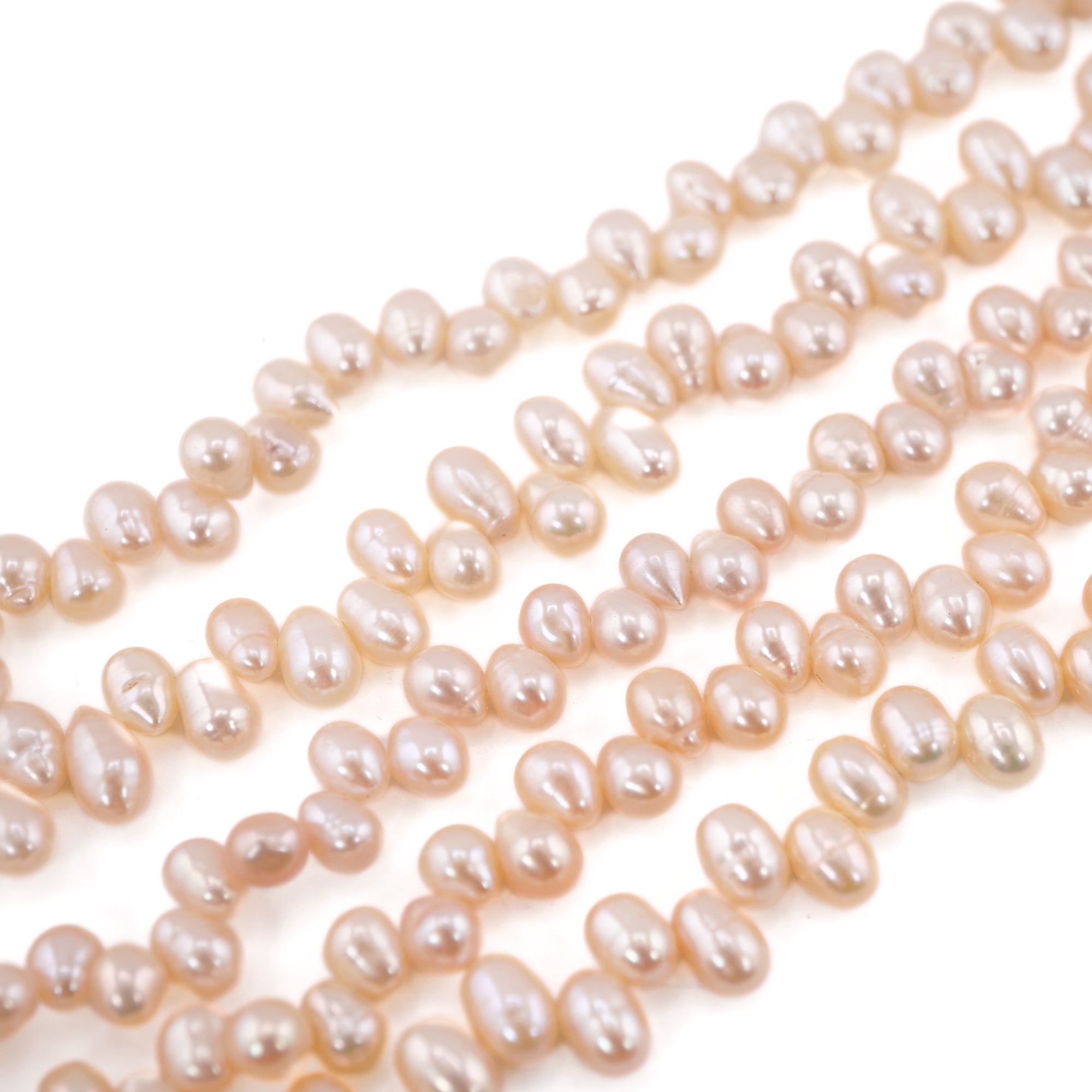 Jewelry making with oval peach pearls

