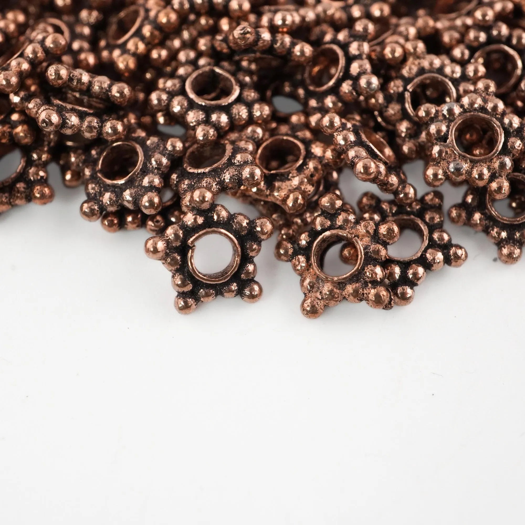 Large hole copper daisy beads

