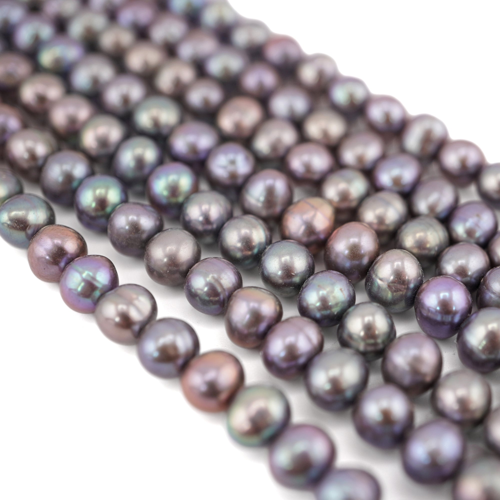 Oval shaped peacock pearls

