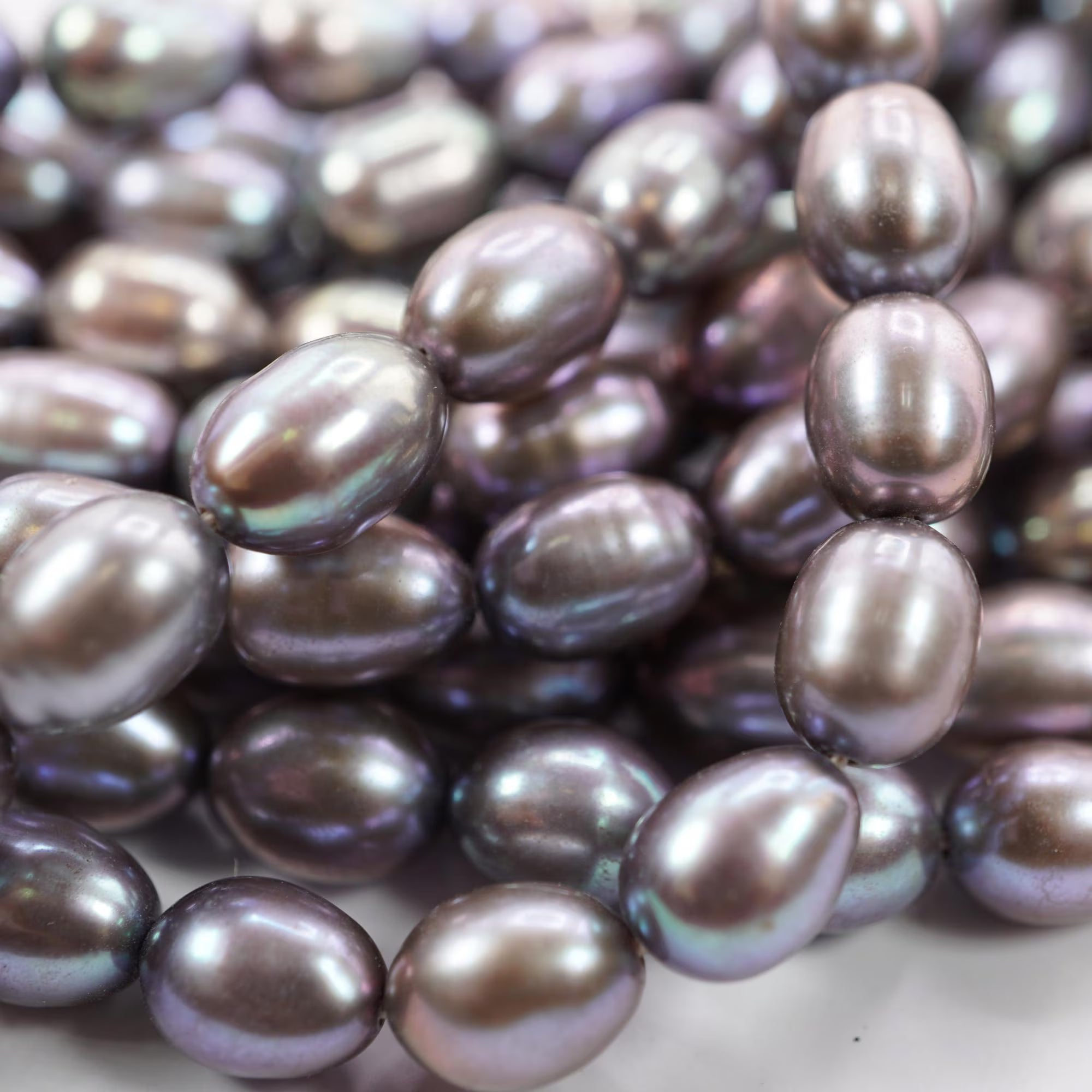 Peacock Freshwater Pearls Oval Shape Smooth Beads