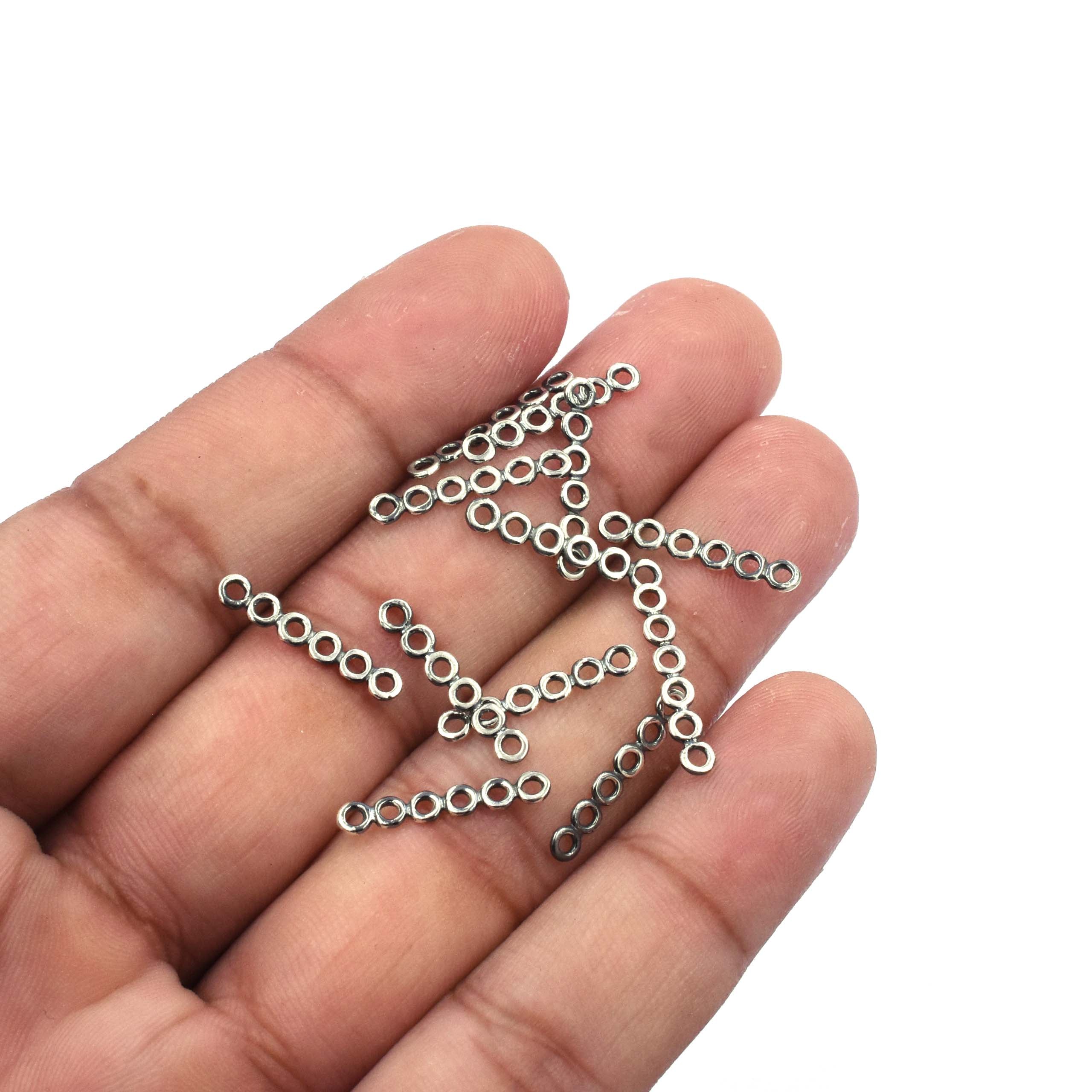Spacer bar separators for multi-strand designs

